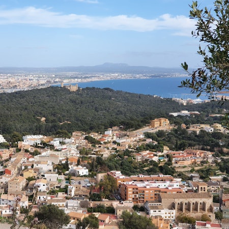 View of Genova, Mallorca, Balearic Islands, Spain, with the Castel Belver in the middle of the picture and Palma de Mallorca in the background