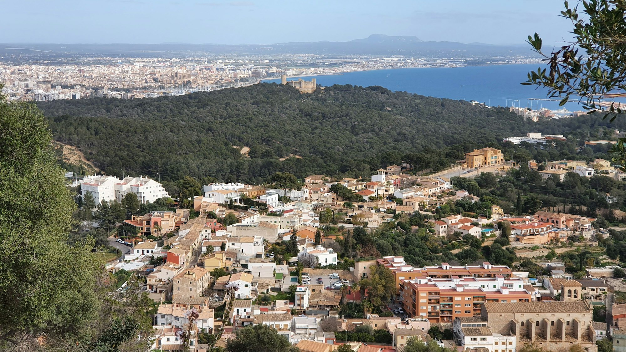 View of Genova, Mallorca, Balearic Islands, Spain, with the Castel Belver in the middle of the picture and Palma de Mallorca in the background