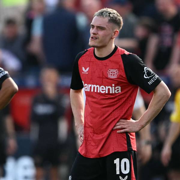 Bayer Leverkusen's French forward #21 Amine Adli (L) and Bayer Leverkusen's German midfielder #10 Florian Wirtz react after the German first division Bundesliga football match between Bayer Leverkusen and Union Berlin in Leverkusen, western Germany, on April 12, 2025. (Photo by INA FASSBENDER / AFP) / DFL REGULATIONS PROHIBIT ANY USE OF PHOTOGRAPHS AS IMAGE SEQUENCES AND/OR QUASI-VIDEO