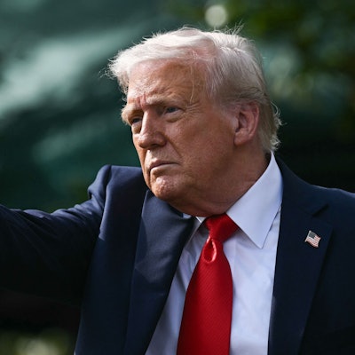 US President Donald Trump gestures after hosting the 2025 College Football National Champions, Ohio State Buckeyes, celebrating the team's title-winning season with a ceremony on the South Lawn of the White House in Washington, DC, April 14, 2025. (Photo by Brendan SMIALOWSKI / AFP) / ALTERNATE CROP