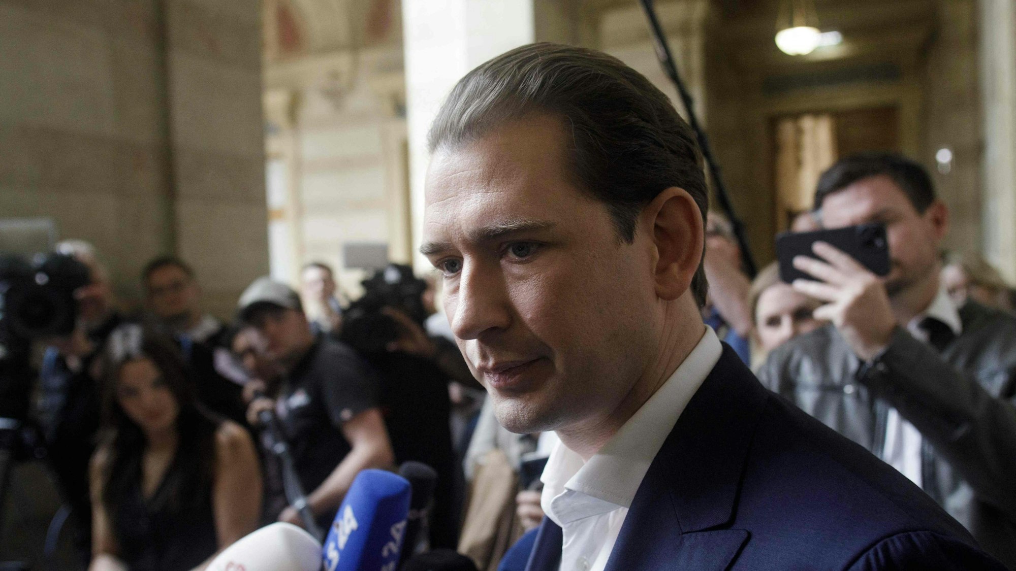 Austria's former Chancellor Sebastian Kurz leaves the court after the hearing of his appeal against his conviction for giving false testimony, on May 26, 2025 in Vienna, Austria. The Vienna Court of Appeal overturned Kurz's conviction for giving false testimony. Once hailed as the "wunderkind" of Europe's conservatives, Kurz resigned as chancellor in 2021 amid a series of accusations. He was found guilty in 2024 of giving false testimony to a parliamentary inquiry and handed an eight-month suspended jail sentence. (Photo by Alex HALADA / AFP)