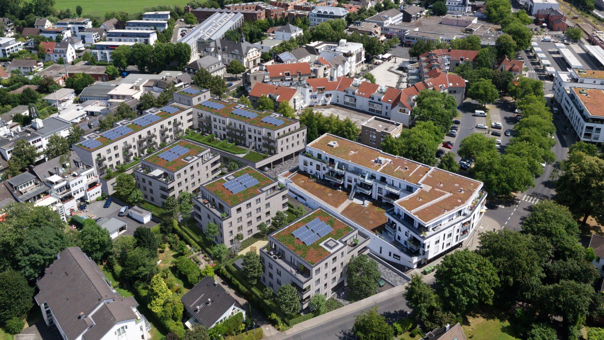 Blick aus südlicher Vogelperspektive auf die geplante und bestehende Bebauung mit der Mozartstraße im Vordergrund.