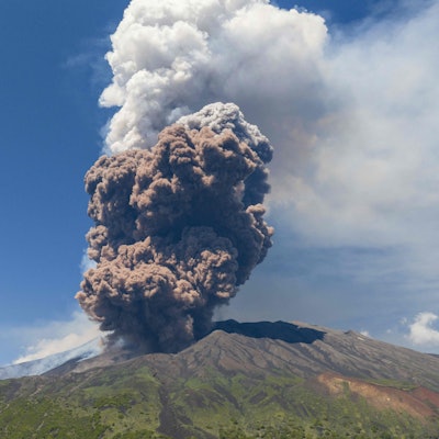 Smoke rises from the crater of the Etna volcano as it erupts, on Mount Etna near Catania on June 2, 2025. A huge plume of ash, gas and rock spewed forth on June 2, 2025, from Italy's Mount Etna, Europe's largest active volcano, after a portion of its southeastern crater likely collapsed, authorities said. (Photo by Giuseppe Distefano / AFP)