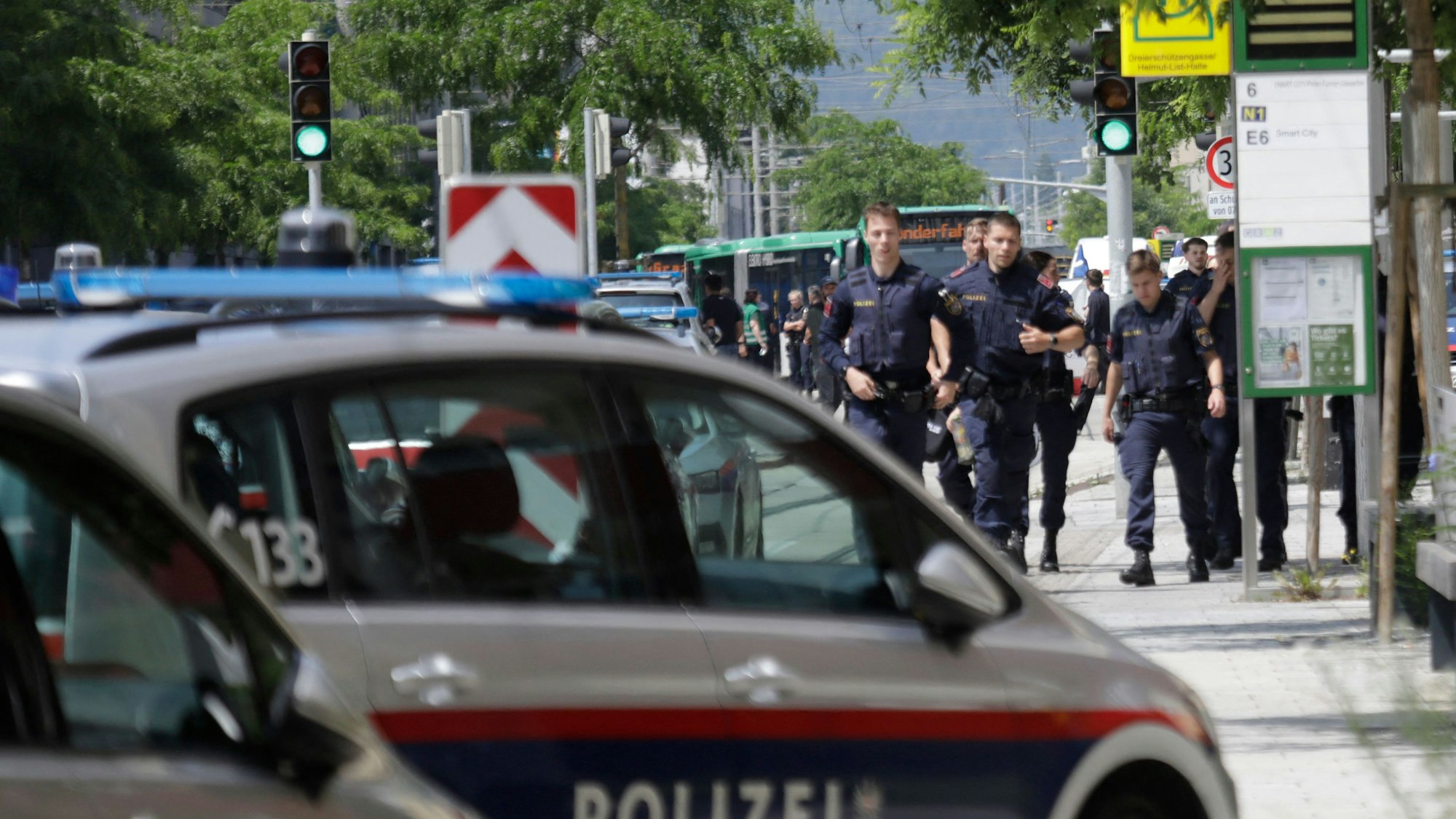Police walk near a school where several people died in a shooting, on June 10, 2025 in Graz, southeastern Austria. Ten people died after a suspected shooter opened fire in a southeastern Austrian school, press agency APA quoted Graz city mayor Elke Kahr as saying. Several students and at least one adult are among those killed, Kahr confirmed to APA. (Photo by Alex HALADA / AFP)