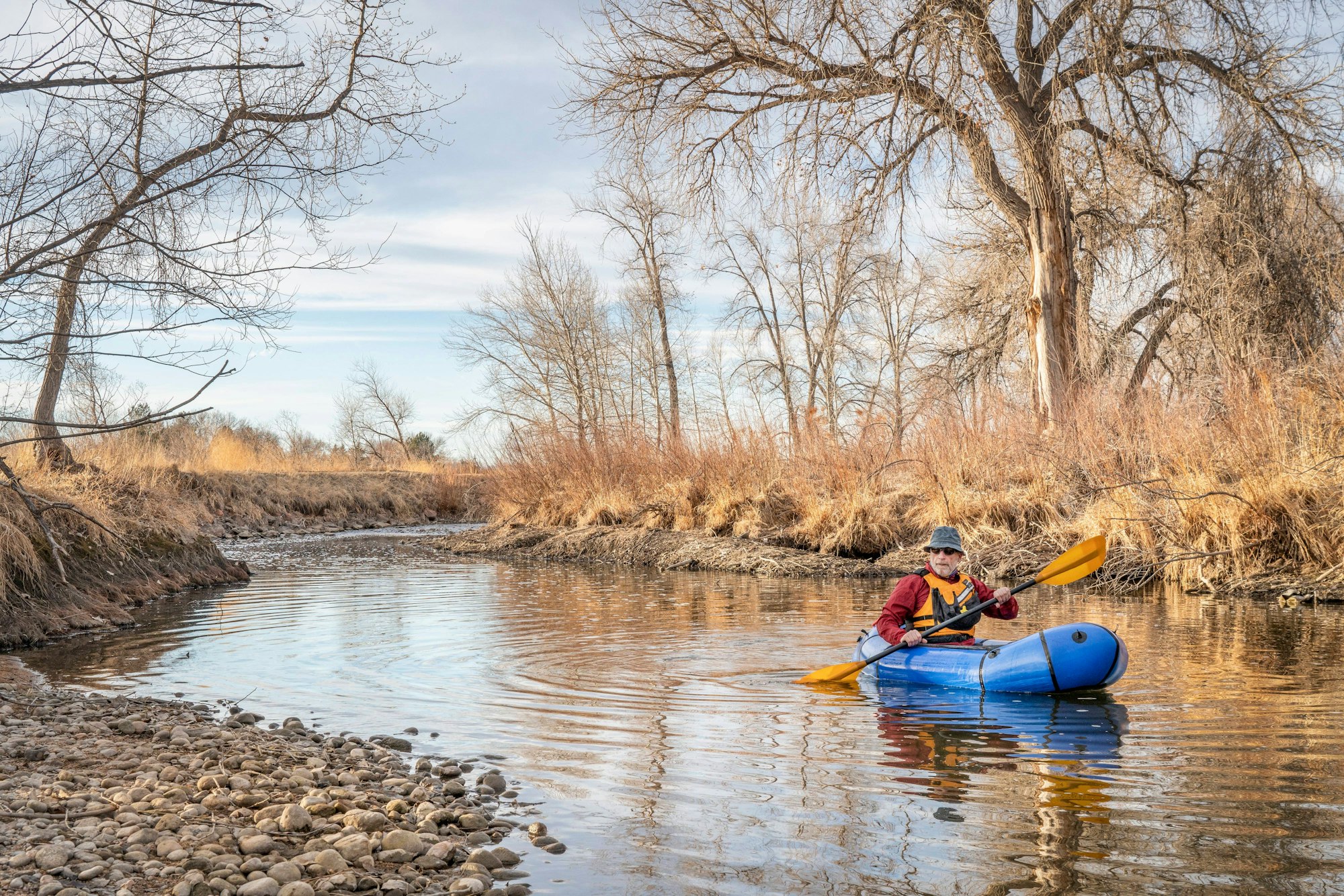 senior male is paddling an inflatable packraft senior male is paddling an inflatable packraft on a river in early spring spring - Poudre River in northern Colorado LicenseRF 16868768 ,model released, Symbolfoto Copyright: xZoonar.com/MarekxUliaszx 16868768 ,model released, Symbolfoto ,property released