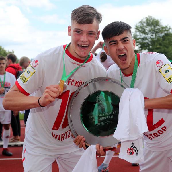 DORTMUND, GERMANY - JUNE 16: (L-R) Florian Wirtz abnd Jens Castrop of Koeln celebrate with the German Championship trohphy after the B-Juniors Bundesliga Final match between Borussia Dortmund and 1. FC Koeln at Stadium Rote Erde on June 16, 2019 in Dortmund, Germany. The match between Dortmund and Koeln ended 2-3. (Photo by Christof Koepsel/Bongarts/Getty Images)