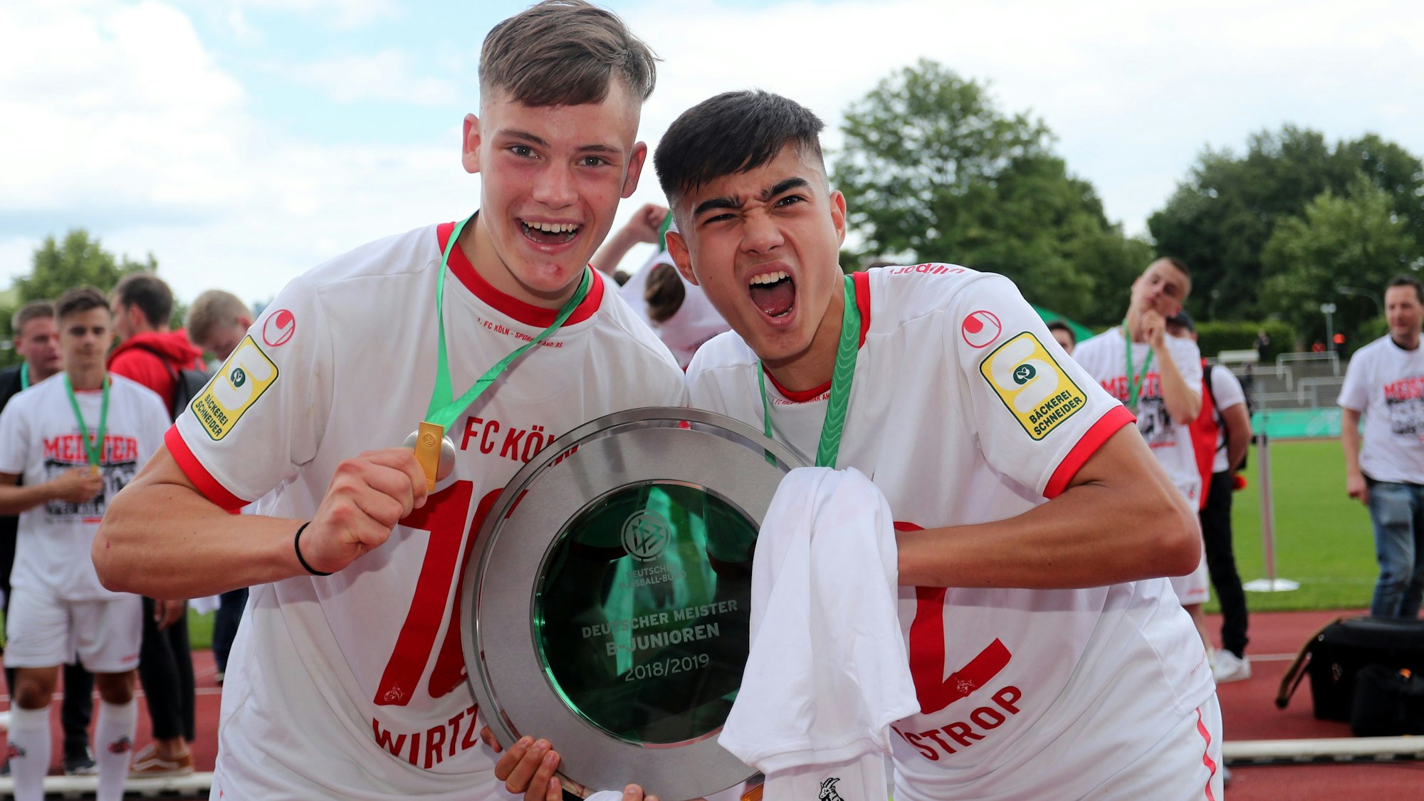 DORTMUND, GERMANY - JUNE 16: (L-R) Florian Wirtz abnd Jens Castrop of Koeln celebrate with the German Championship trohphy after the B-Juniors Bundesliga Final match between Borussia Dortmund and 1. FC Koeln at Stadium Rote Erde on June 16, 2019 in Dortmund, Germany. The match between Dortmund and Koeln ended 2-3. (Photo by Christof Koepsel/Bongarts/Getty Images)