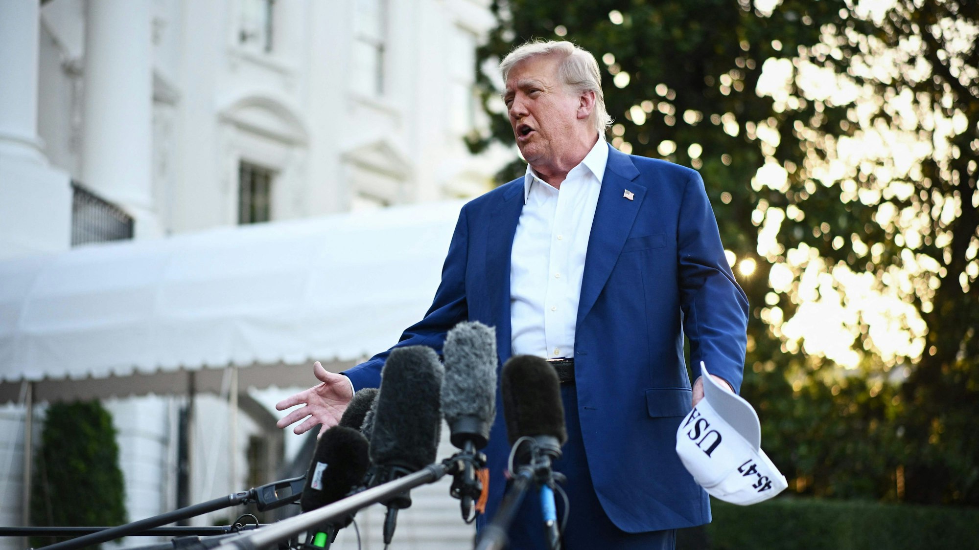 US President Donald Trump speaks to the press before boarding Marine One from the South Lawn of the White House in Washington, DC on June 24, 2025, to attend the NATO's Heads of State and Government summit in The Hague. (Photo by Mandel NGAN / AFP)