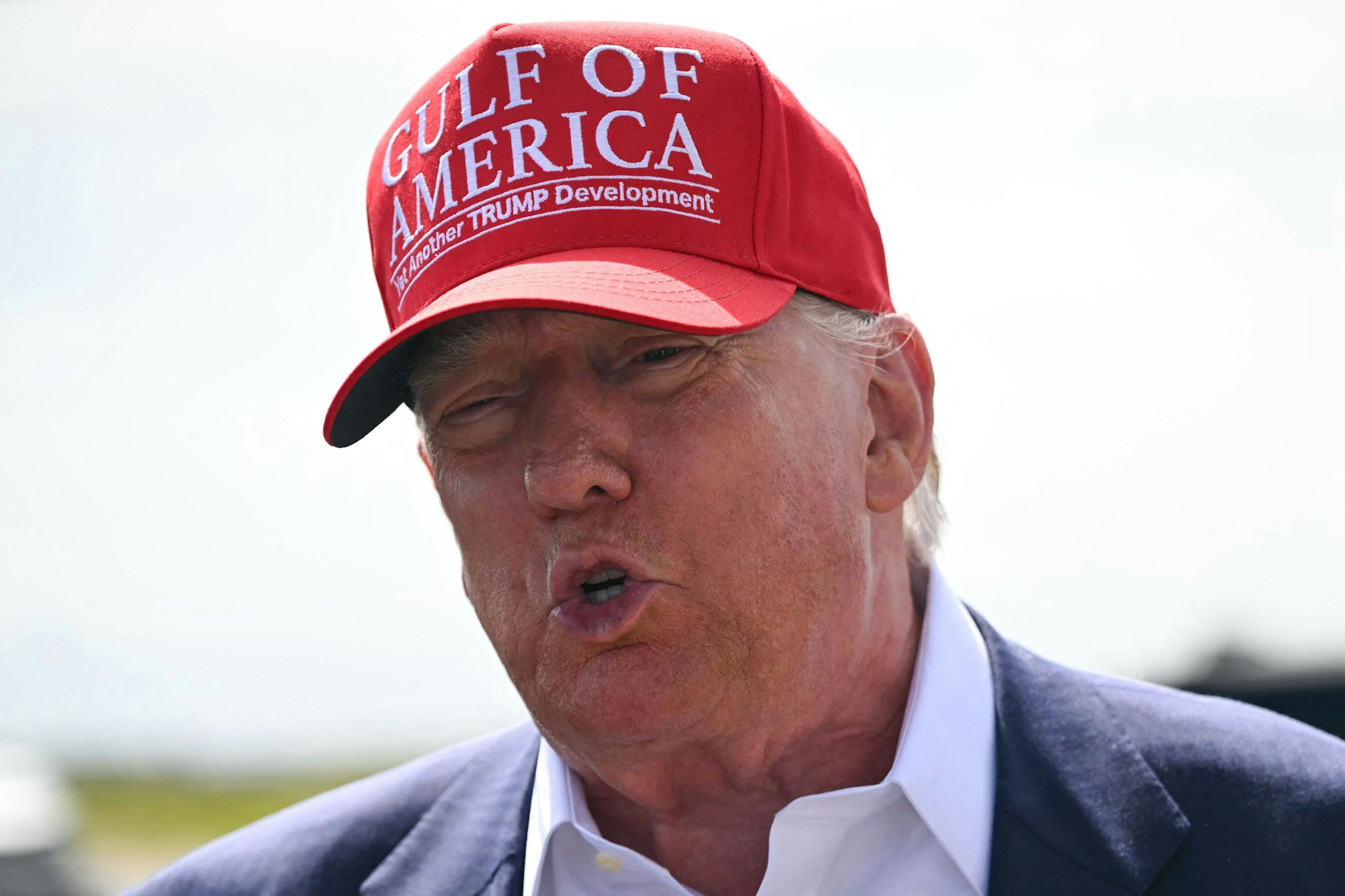 US President Donald Trump speaks to reporters after arriving at Dade-Collier Training and Transition Airport in Ochopee, Florida, on July 1, 2025. President Trump is visiting a migrant detention center in a reptile-infested Florida swamp dubbed "Alligator Alcatraz." Trump will attend the opening of the 5,000-bed facility -- located at an abandoned airfield in the Everglades wetlands -- part of his expansion of deportations of undocumented migrants, his spokeswoman said. (Photo by ANDREW CABALLERO-REYNOLDS / AFP)