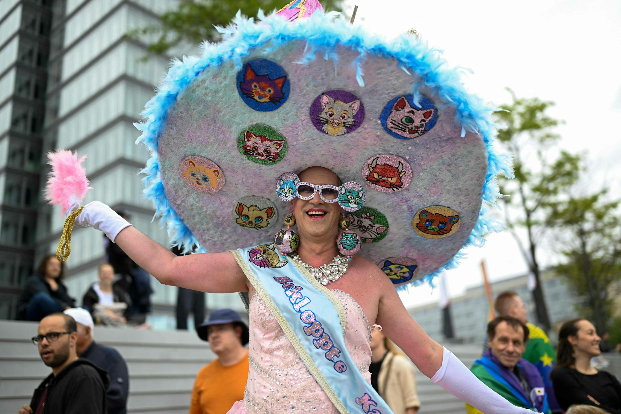A reveller poses before taking part in the Christopher Street Day (CSD) demonstration in Cologne, western Germany on July 6, 2025. The motto of this year's demonstration is "For queer rights. Many. Strong together." (Photo by INA FASSBENDER / AFP)