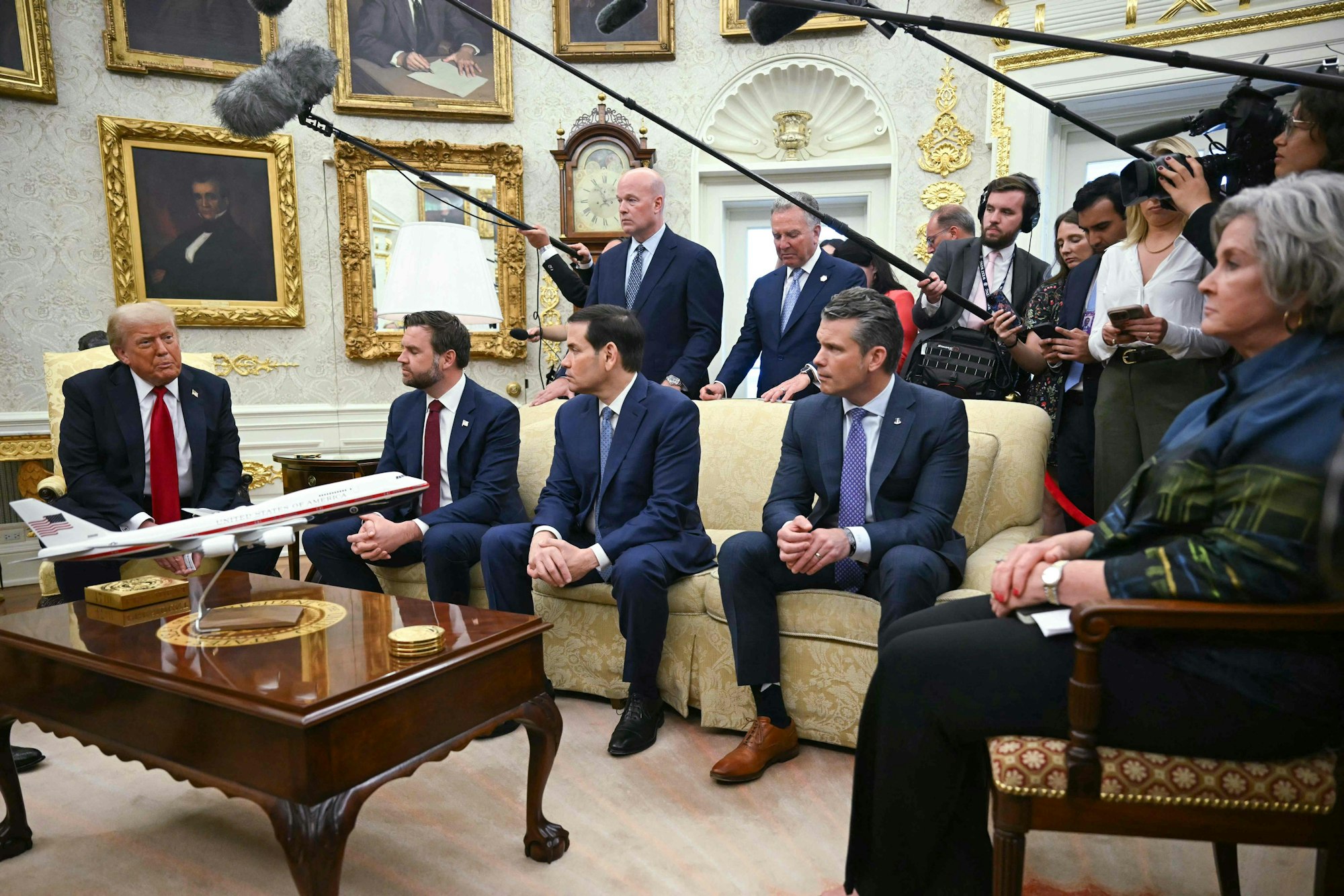 US President Donald Trump (L) speaks during a meeting with NATO Secretary General Mark Rutte (out of frame) in the Oval Office of the White House in Washington, DC on July 14, 2025. Also pictured, L/R, US Vice President JD Vance, Secretary of State Marco Rubio, US Ambassador to NATO Matthew Whitaker, US Special Envoy to the Middle East Steve Witkoff, Defense Secretary Pete Hegseth, and White House Chief of Staff Susie Wiles. President Trump warned Russia on Monday that he will impose "very severe" tariffs against Moscow's remaining trade partners if it doesn't resolve its war in Ukraine within 50 days. (Photo by ANDREW CABALLERO-REYNOLDS / AFP)