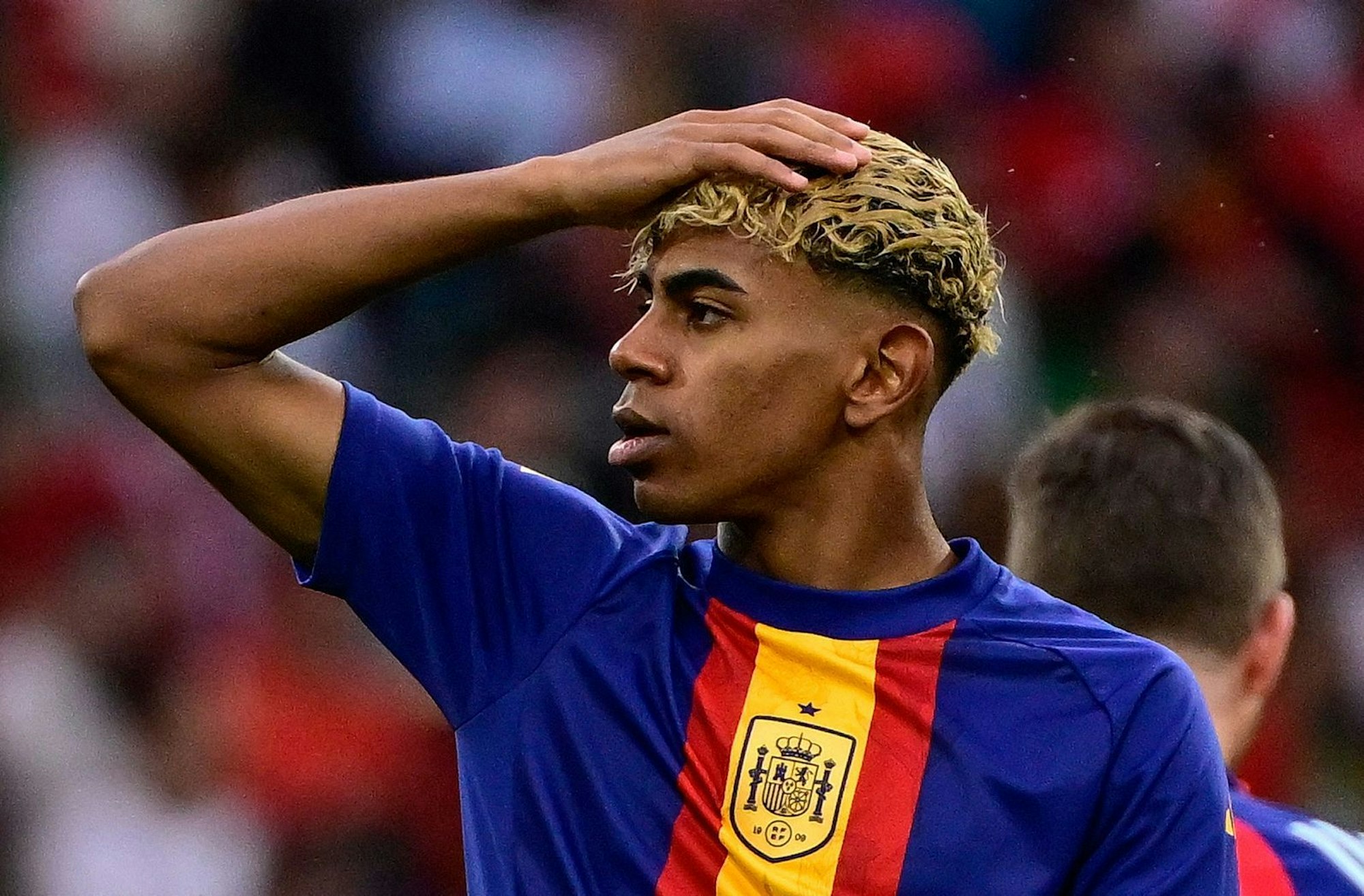 (FILES) Spain's forward #19 Lamine Yamal warms up prior to the UEFA Nations League final football match between Portugal and Spain in Munich, southern Germany on June 8, 2025. Barcelona star Lamine Yamal is facing an investigation regarding the presence of a group of people with dwarfism as entertainers at his 18th birthday party last weekend, Spain's Ministry of Social Rights told AFP Tuesday.
The winger celebrated with a private event in Olivella, around 50 kilometres west of Barcelona, which the ministry asked the prosecutor's office to probe, following a complaint from the Association for People with Achondroplasia and Other Skeletal Dysplasias with Dwarfism (ADEE). (Photo by John MACDOUGALL / AFP) / ALTERNATIVE CROP