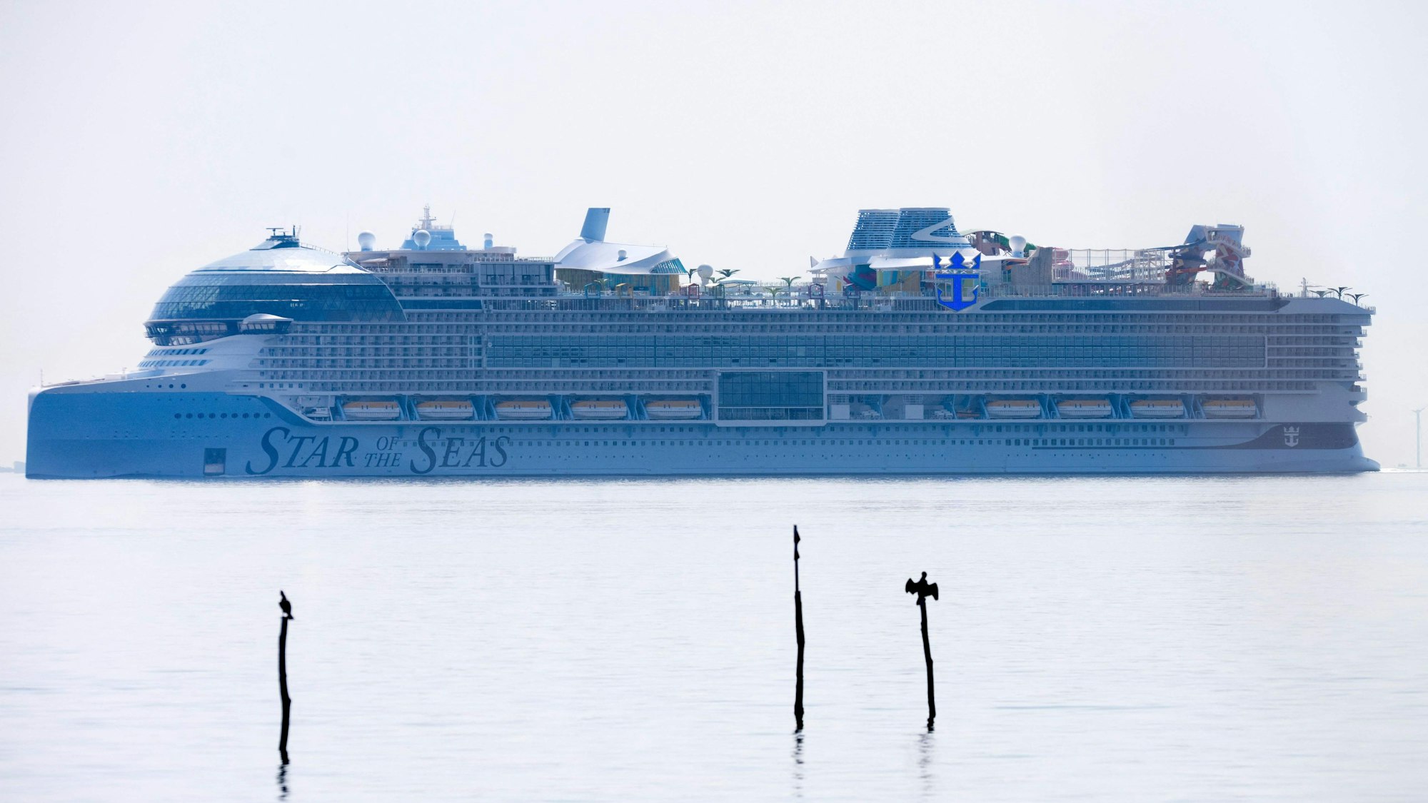 The 'Star of the Seas' cruise ships is pictured as it sails through the Great Belt in Denmark, on July 19, 2025. 'Star of the Seas' departed on the evening of July 17, 2025 from Turku in Finland and set out on its maiden voyage after being completed at the Meyer Turku shipyard. (Photo by Thomas Sjoerup / Ritzau Scanpix / AFP) / Denmark OUT