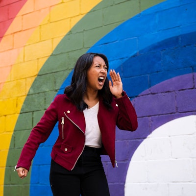 Woman screaming in front of rainbow wall model released, Symbolfoto property released, AMWF03242