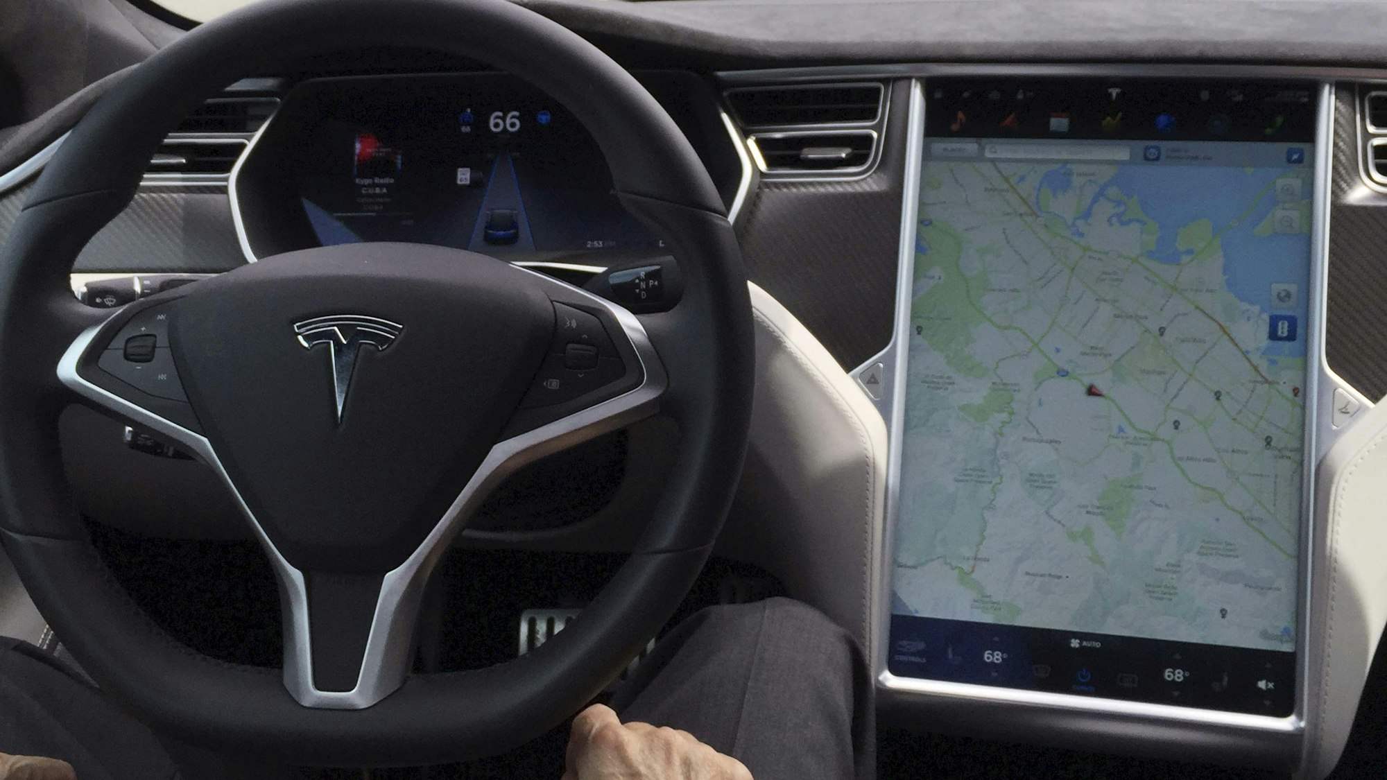 The interior of a Tesla Model S is shown in autopilot mode in San Francisco, California, U.S., April 7, 2016. REUTERS/Alexandria Sage/File Photo