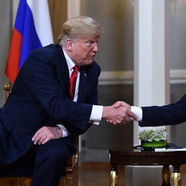 (FILES) Russian President Vladimir Putin (R) and US President Donald Trump shake hands before a meeting in Helsinki on July 16, 2018. US President Donald Trump said on August 8, 2025 he would meet with Russian counterpart Vladimir Putin on August 15 in Alaska, as the Republican billionaire hopes to help mediate an end to the war in Ukraine. (Photo by Brendan Smialowski / AFP)
