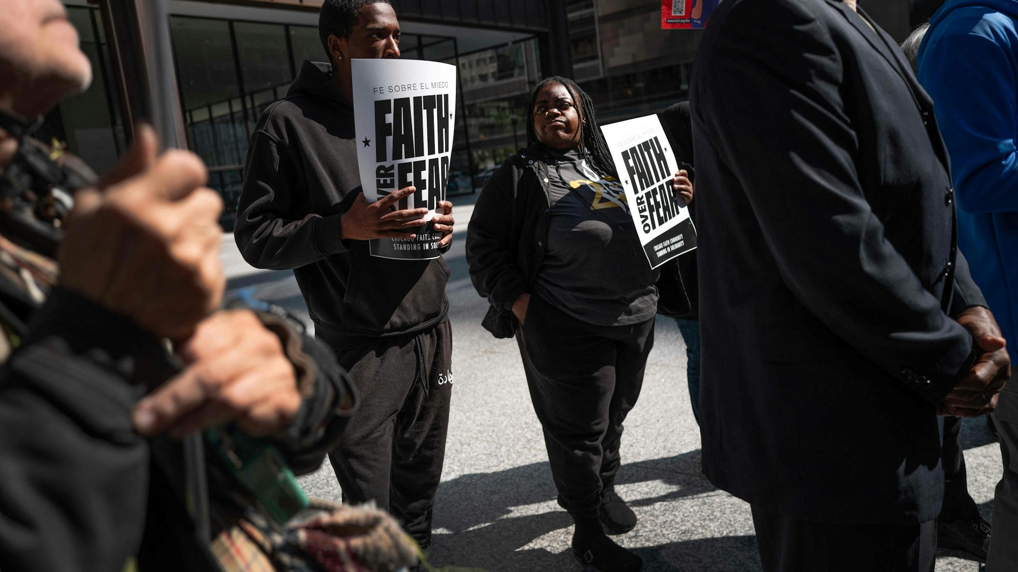 CHICAGO, ILLINOIS - SEPTEMBER 08: People rally around a group of interfaith clergy members as they hold a press conference downtown to denounce the Trump administration's proposed immigration sweeps in the city on September 08, 2025 in Chicago, Illinois. The Trump administration has threatened a surge in ICE raids in the Chicago area that is expected to begin any day. Scott Olson/Getty Images/AFP (Photo by SCOTT OLSON / GETTY IMAGES NORTH AMERICA / Getty Images via AFP)