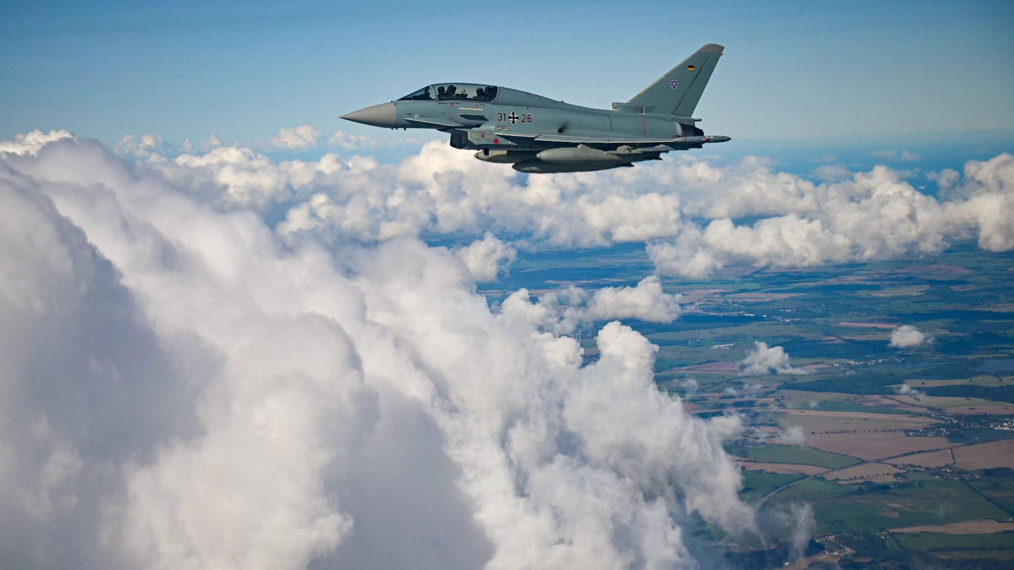 A Eurofighter Typhoon of the German Air Force (31 26) is seen in flight during a demonstration as part of a press day at the military air base in Laage, south of Rostock, northeastern Germany on September 23, 2025. (Photo by Tobias Schwarz / AFP)
