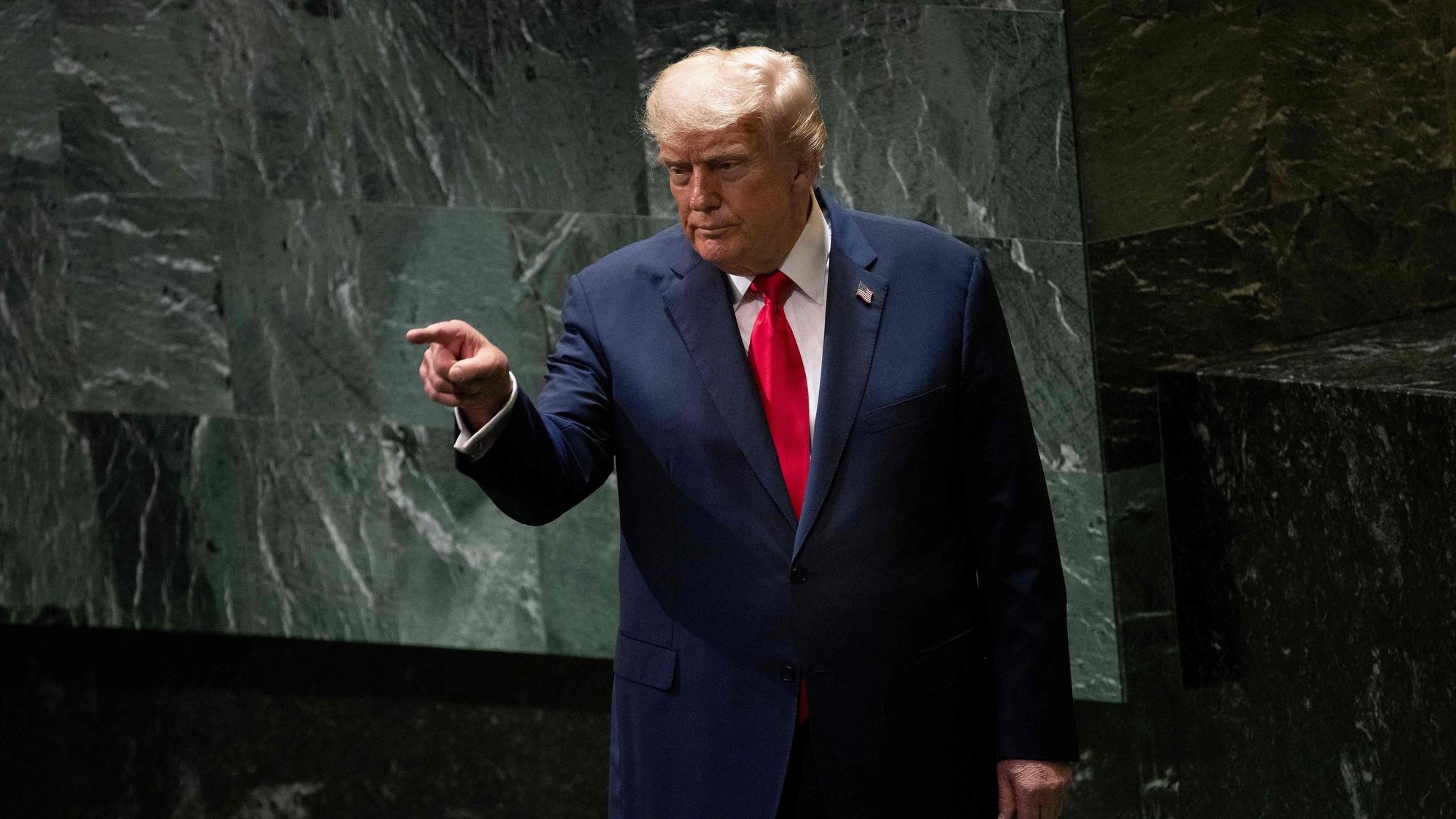 US President Donald Trump points to attendees after delivering remarks to the United Nations General Assembly at the UN headquarters in New York City on September 23, 2025. (Photo by Brendan Smialowski / AFP)
