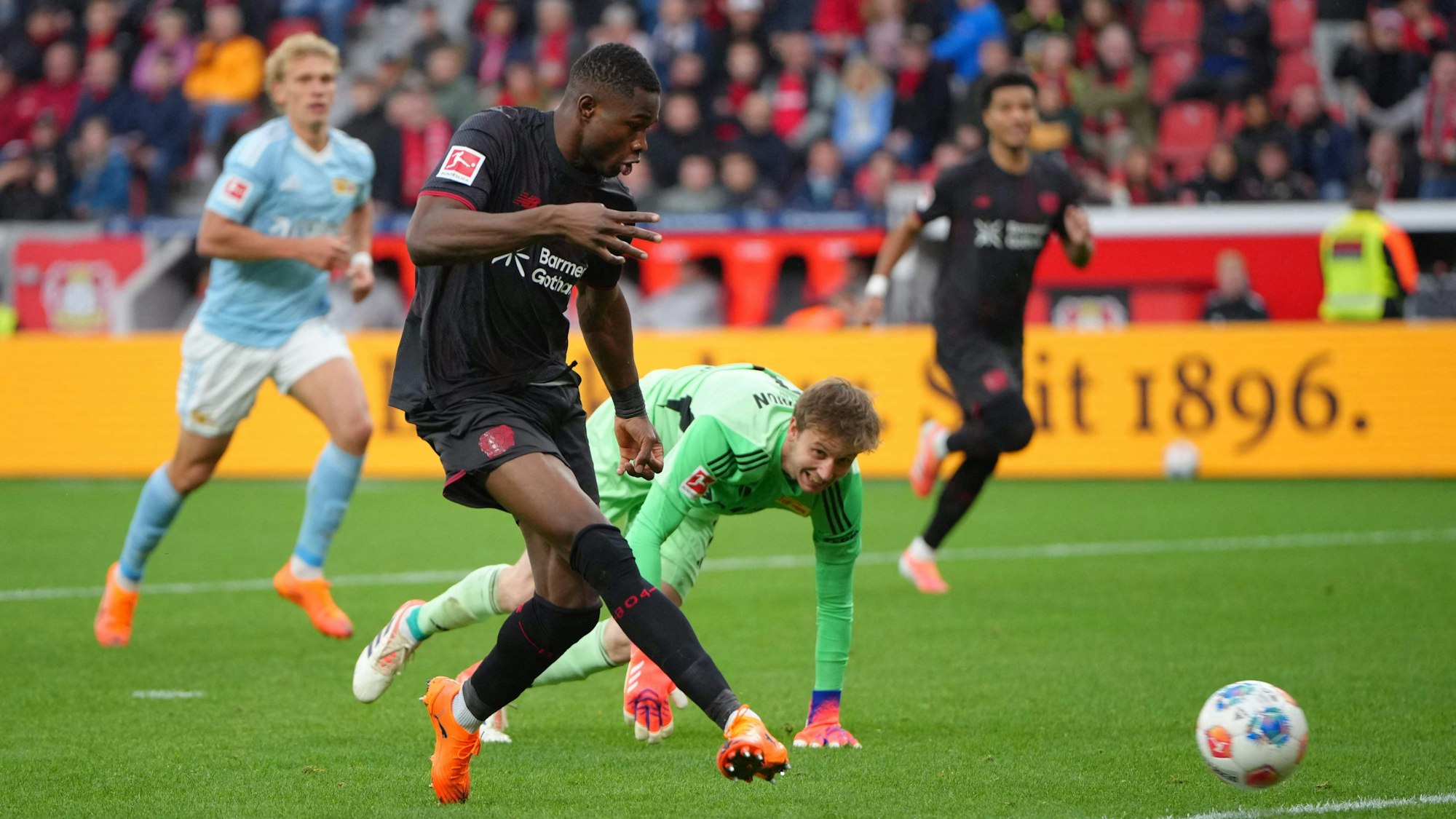 Bayer Leverkusen's Cameroonian forward #35 Christian Kofane scores the 2-0 during the German first division Bundesliga football match between Bayer 04 Leverkusen and 1. FC Union Berlin in Leverkusen, western Germany on October 4, 2025. (Photo by Pau Barrena / AFP) / DFL REGULATIONS PROHIBIT ANY USE OF PHOTOGRAPHS AS IMAGE SEQUENCES AND/OR QUASI-VIDEO