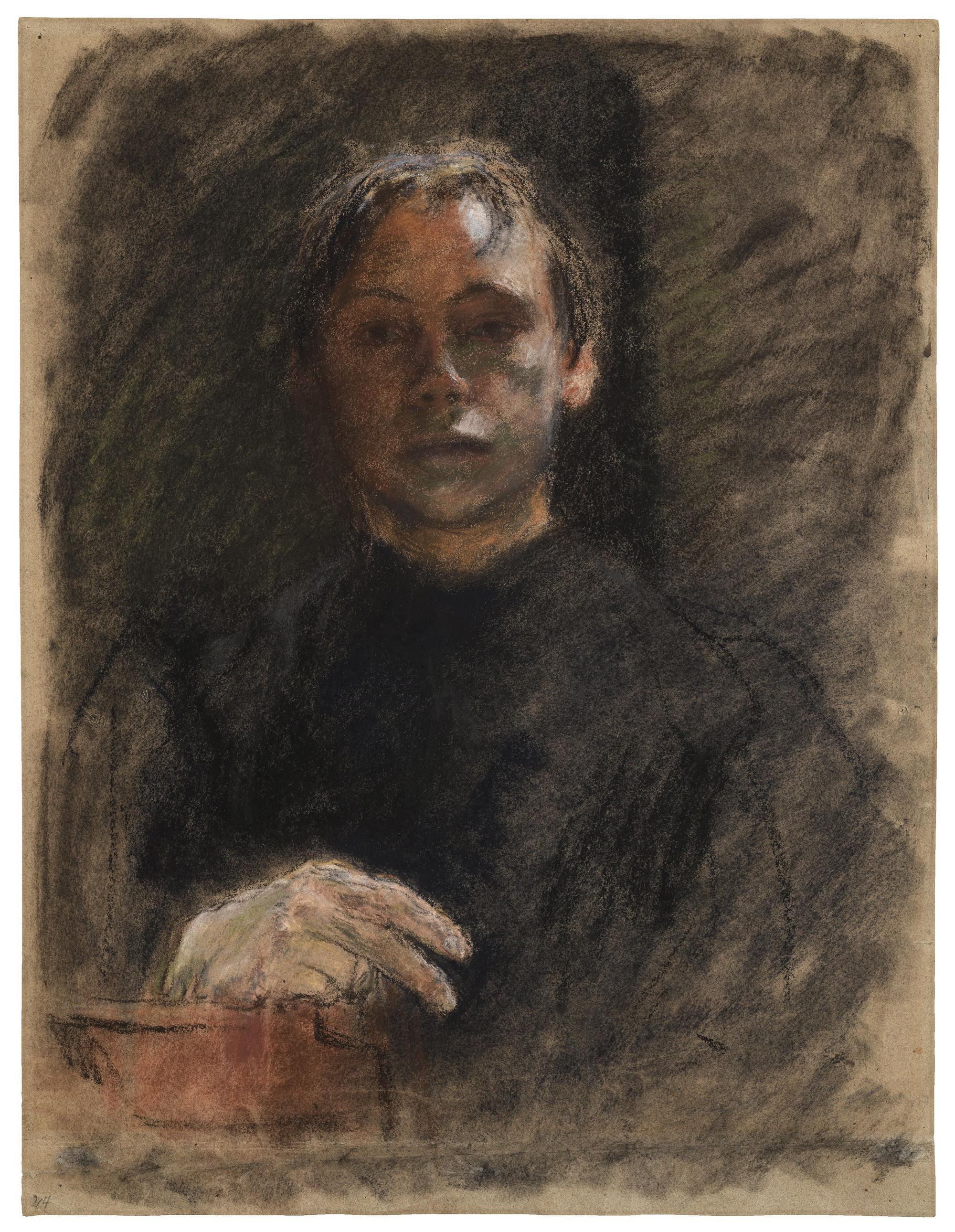 Käthe Kollwitz schaut den Betrachter mit ernstem Blick an.