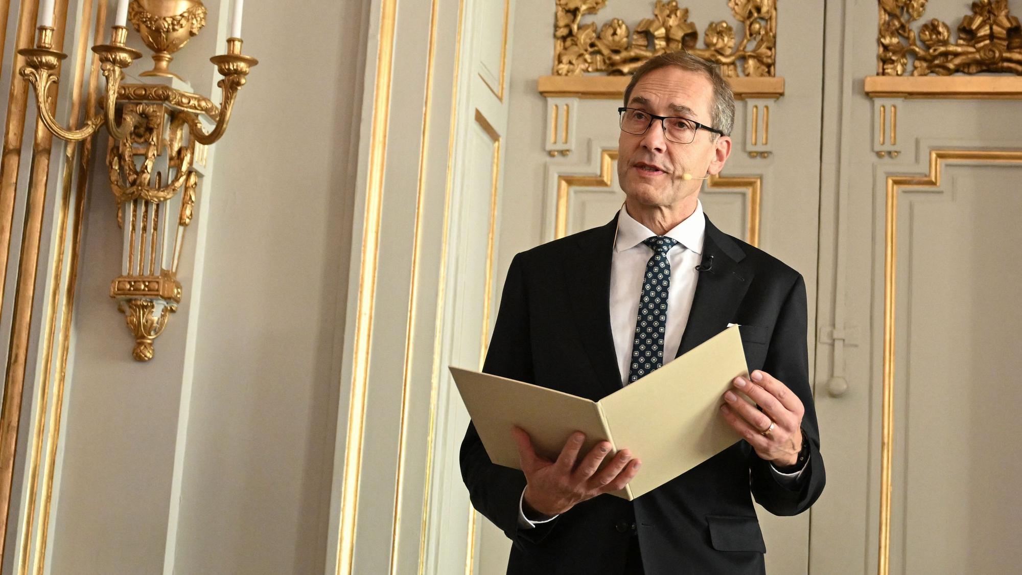 TOPSHOT - Mats Malm, Permanent Secretary of the Swedish Academy, announces Hungary's Laszlo Krasznahorkai as the winner of the 2025 Nobel Prize in Literature at the Swedish Academy in Stockholm, Sweden, on October 9, 2025.