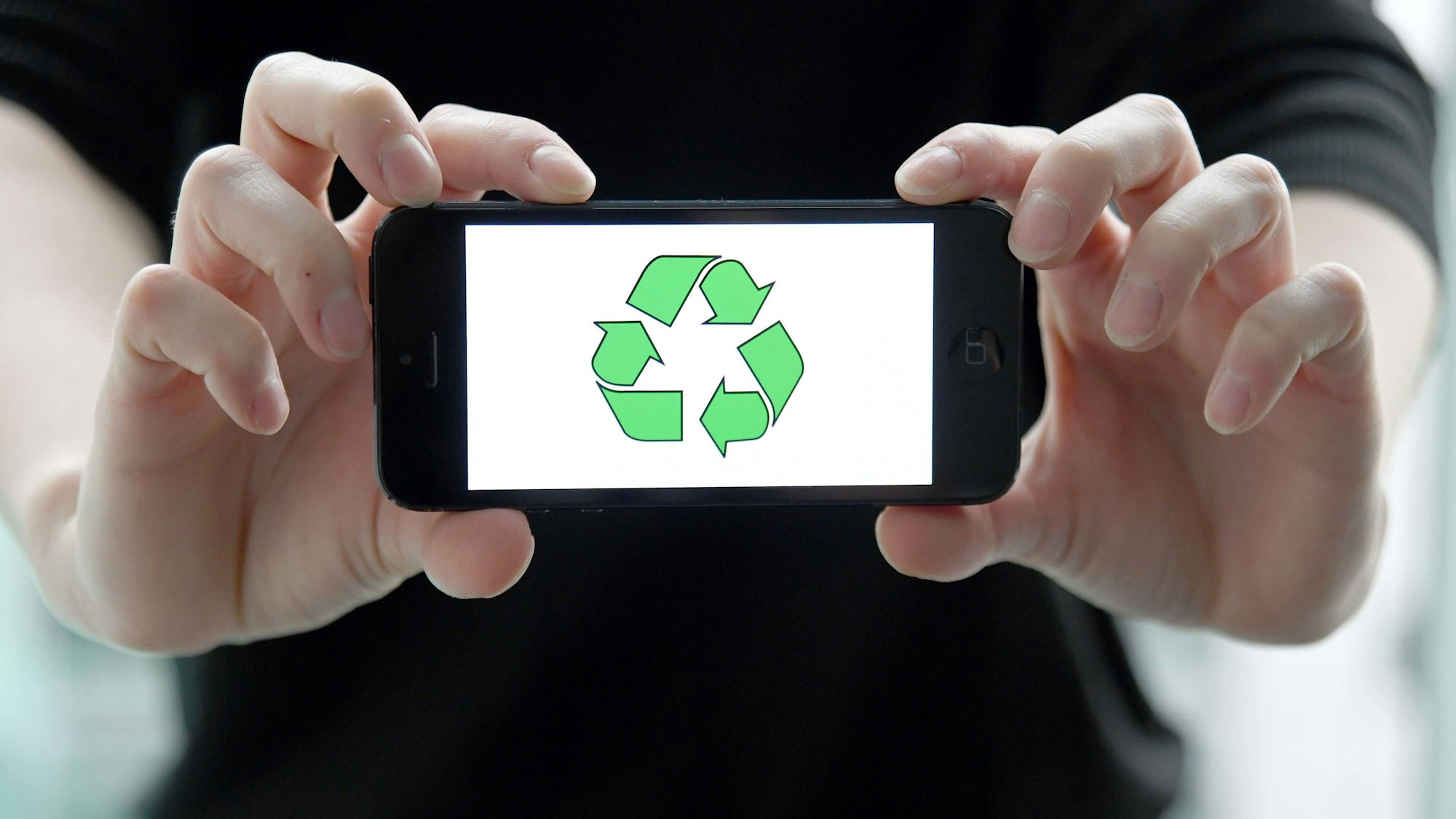 Ein Smartphone mit einem Kreislauf-Symbol auf dem Bildschirm.