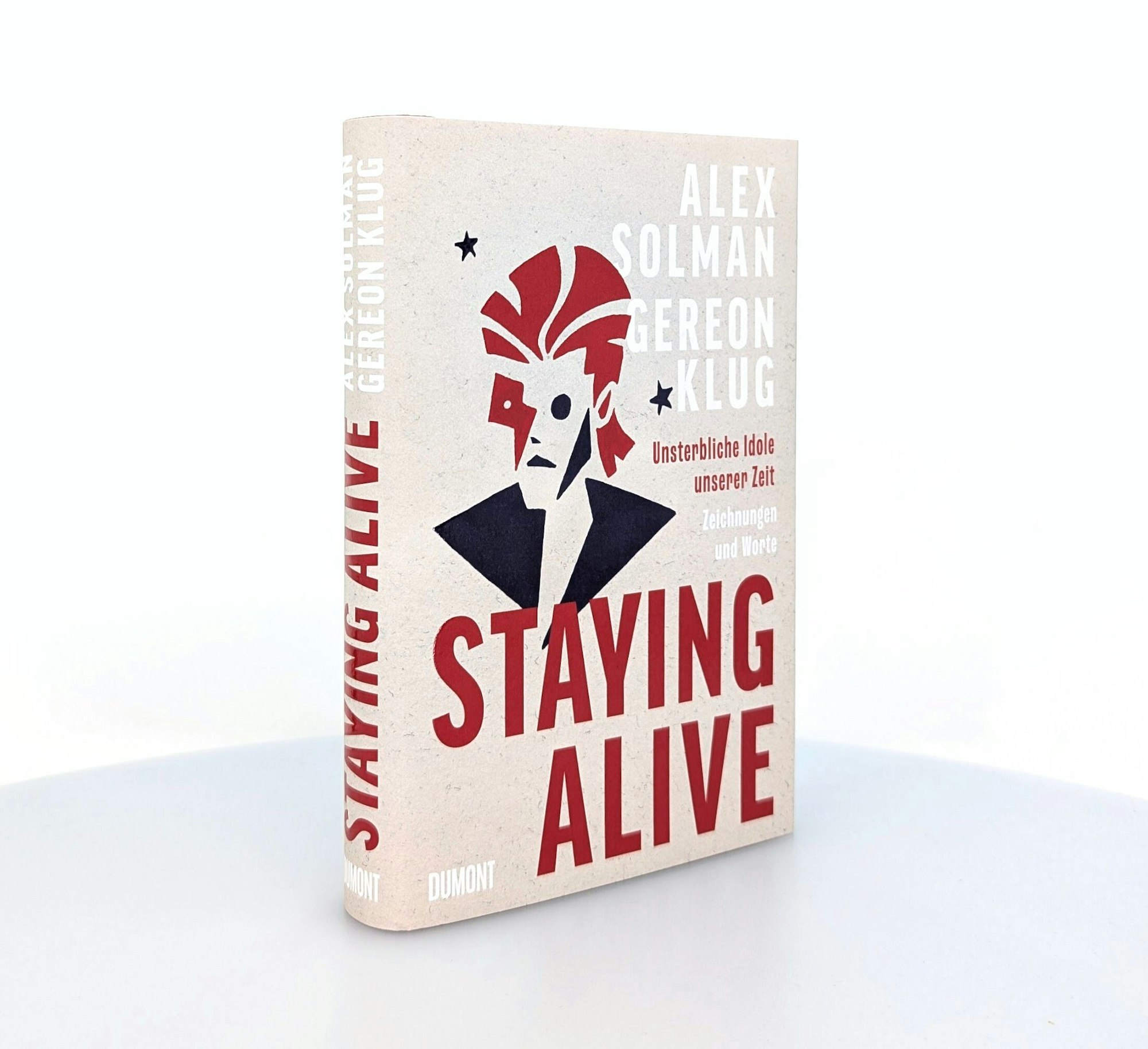 Auf dem Bild ist eine Abbildung des Covers des Buches Staying Alive zu sehen. Foto: Dumont Buchverlag