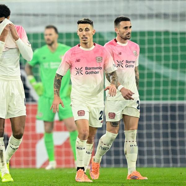 Leverkusen players including English defender #04 Jarell Quansah (L) and Spanish defender #20 Alejandro Grimaldo react during the German Cup (DFB Pokal) second round football match between SC Paderborn and Bayer 04 Leverkusen in Paderborn, western Germany on October 29, 2025. (Photo by INA FASSBENDER / AFP) / DFB REGULATIONS PROHIBIT ANY USE OF PHOTOGRAPHS AS IMAGE SEQUENCES AND QUASI-VIDEO.