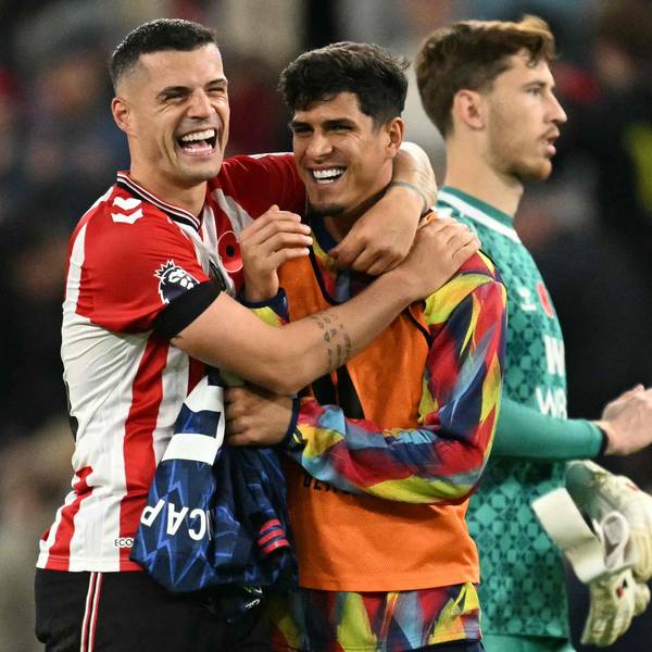 TOPSHOT - Sunderland's Swiss midfielder #34 Granit Xhaka (L) jokes with Arsenal's Ecuadorian defender #05 Piero Hincapie (R) after the final whistle during the English Premier League football match between Sunderland and Arsenal at The Stadium of Light in Sunderland in north east England on November 8, 2025. (Photo by Oli SCARFF / AFP) / RESTRICTED TO EDITORIAL USE. No use with unauthorized audio, video, data, fixture lists, club/league logos or 'live' services. Online in-match use limited to 120 images. An additional 40 images may be used in extra time. No video emulation. Social media in-match use limited to 120 images. An additional 40 images may be used in extra time. No use in betting publications, games or single club/league/player publications. /