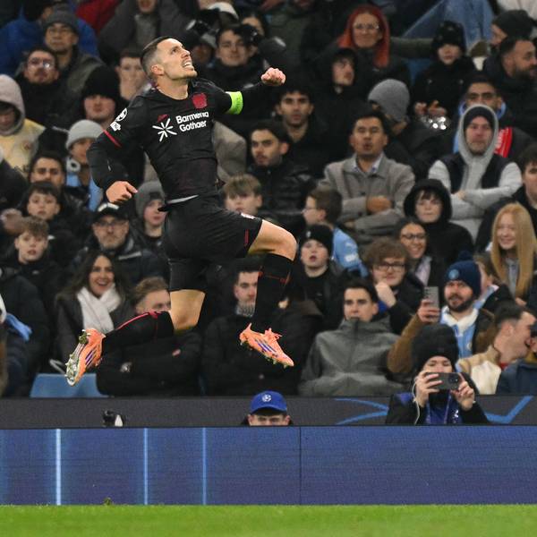 TOPSHOT - Bayer Leverkusen's Spanish defender #20 Alejandro Grimaldo celebrates after scoring the opening goal during the UEFA Champions League league-stage football match between Manchester City and Bayer Leverkusen at the Etihad Stadium in Manchester, north west England, on November 25, 2025. (Photo by Oli SCARFF / AFP)