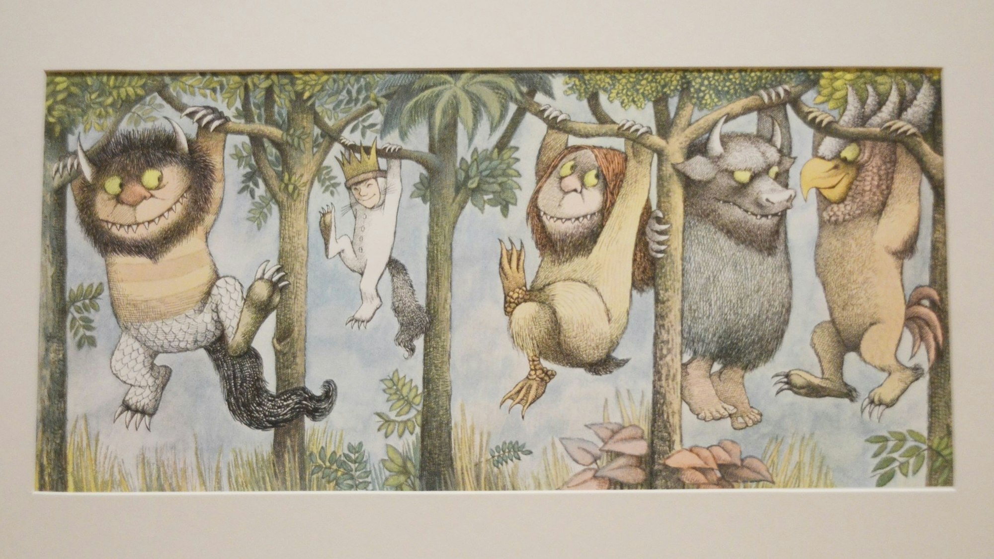 Eine Zeichnung kleiner Monster, die an Bäumen hangeln.