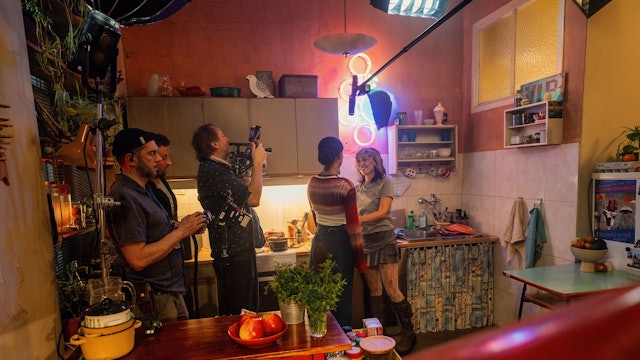 L-R: Behind-the-scenes with Cinematographer Marcus Kanter, Larissa Sirah Herden as Bea and Malaya Stern Takeda as Toni in Parallel Me, episode 4, streaming on Paramount+. Photo Credit: Krzysztof Wiktor/Paramount+