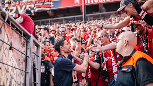 LEVERKUSEN, GERMANY - MAY 11: Xabi Alonso, Head Coach of Bayer 04 Leverkusen greets fans after the Bundesliga match between Bayer 04 Leverkusen and Borussia Dortmund at BayArena on May 11, 2025 in Leverkusen, Germany.