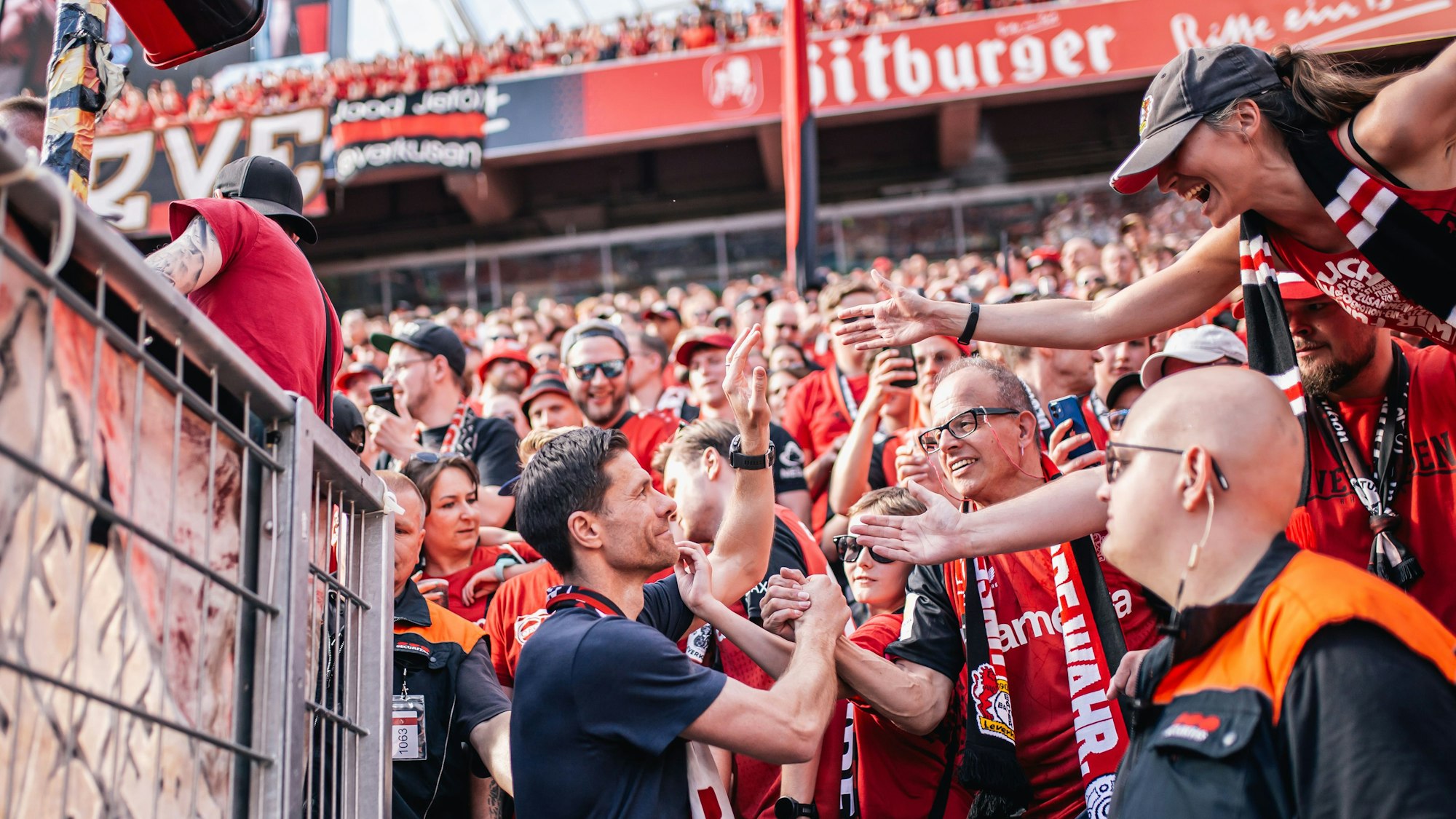 LEVERKUSEN, GERMANY - MAY 11: Xabi Alonso, Head Coach of Bayer 04 Leverkusen greets fans after the Bundesliga match between Bayer 04 Leverkusen and Borussia Dortmund at BayArena on May 11, 2025 in Leverkusen, Germany.