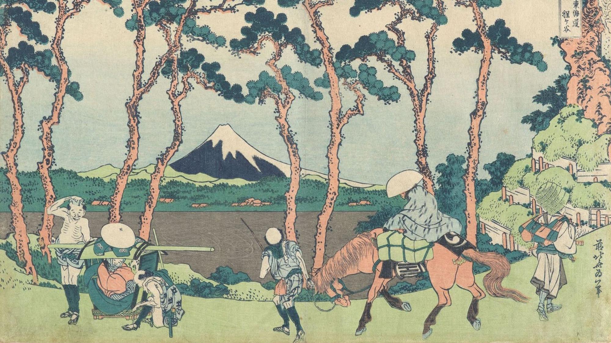 Das Bild zeigt den Berg Fuji mit Reisenden im Vordergrund.