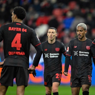 Bayer Leverkusen's Spanish defender #20 Alejandro Grimaldo (2nd L) celebrates scoring the 1-4 goal from the penalty spot with his teammates including Bayer Leverkusen's Brazilian defender #13 Arthur (C) during the German first division Bundesliga football match between Bayer 04 Leverkusen and 1 VfB Stuttgart in Leverkusen, western Germany, on January 10, 2026. (Photo by INA FASSBENDER / AFP) / DFL REGULATIONS PROHIBIT ANY USE OF PHOTOGRAPHS AS IMAGE SEQUENCES AND/OR QUASI-VIDEO