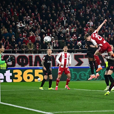 TOPSHOT - Olympiakos' Portuguese defender #20 Costinha heads the ball and score his team's first goal during the during the UEFA Champions League, league phase day 7, football match between Olympiakos and Bayer Leverkusen at the Georgios Karaiskakis Stadium in Piraeus, near Athens, on January 20, 2026. (Photo by Aggelos NAKKAS / AFP)