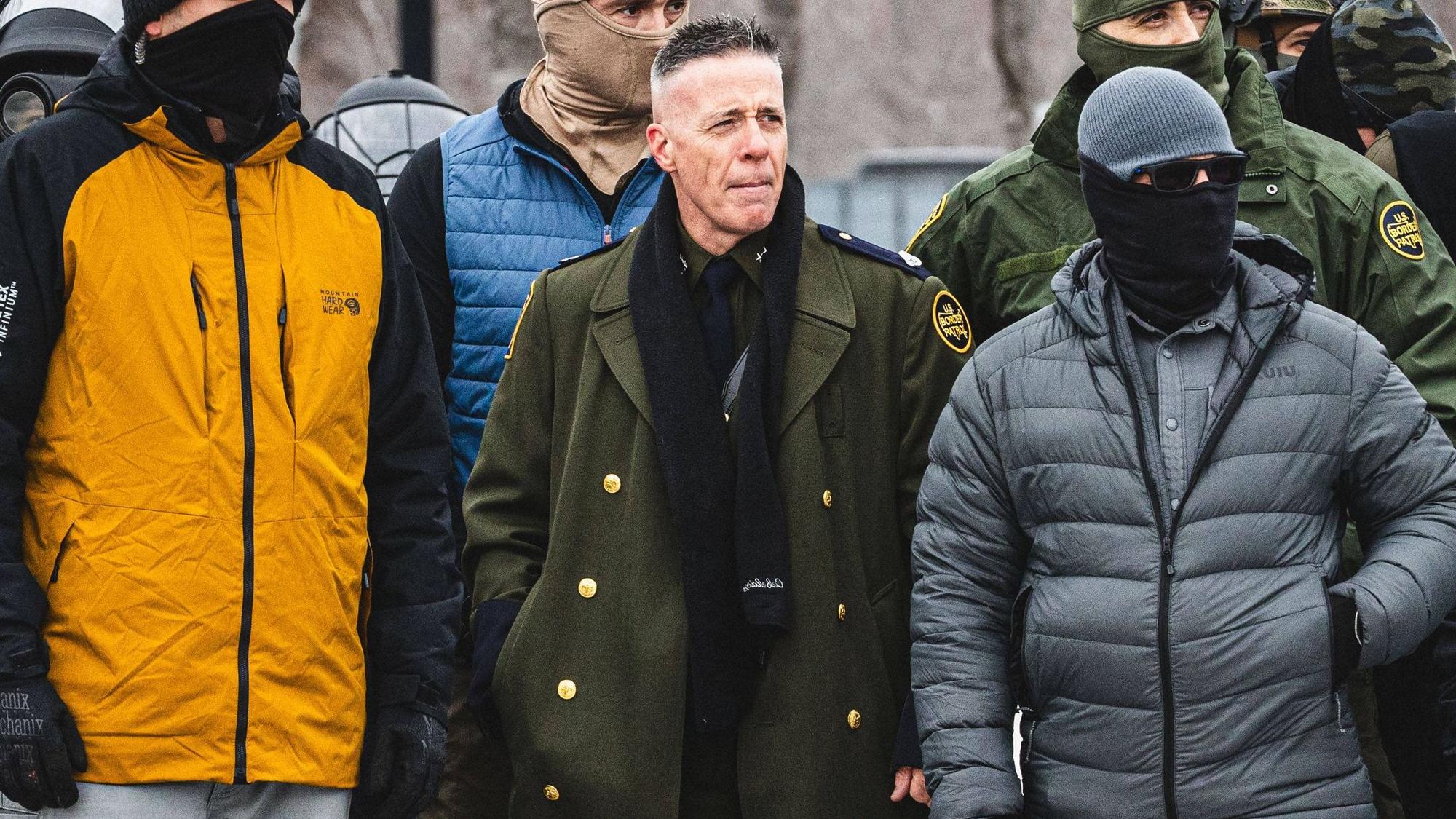 January 15, 2026, Minneapolis, Minnesota, USA: Border Chief GREGORY BOVINO observes a protest as community members gather at the entrance of the Whipple Building in Minneapolis to rally in solidarity with their neighbors whom are being detained by U.S. ICE Immigration and Customs Enforcement agents Minneapolis USA.