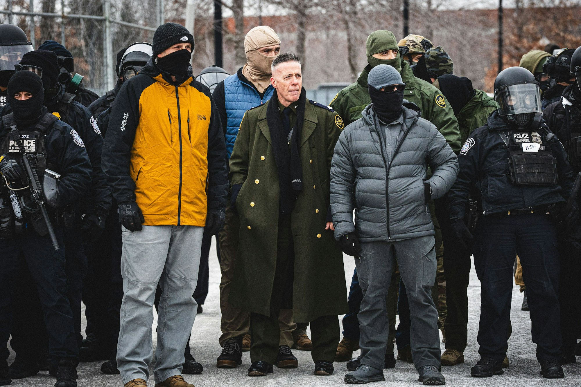 January 15, 2026, Minneapolis, Minnesota, USA: Border Chief GREGORY BOVINO observes a protest as community members gather at the entrance of the Whipple Building in Minneapolis to rally in solidarity with their neighbors whom are being detained by U.S. ICE Immigration and Customs Enforcement agents Minneapolis USA - ZUMAd256 20260115_znp_d256_032 Copyright: xDavexDeckerx