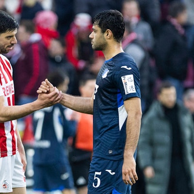 COLOGNE, GERMANY - FEBRUARY 21: Cenk Oezkacar Özkacar, Ozkacar, 1. FC Koeln, 39 and Ozan Kabak TSG 1899 Hoffenheim, 5 shake hands after the Bundesliga match between 1. FC Koeln vs. TSG 1899 Hoffenheim on matchday 23 at RheinEnergie-Stadion on February 21st, 2026 in Cologne, Germany. DFL regulations prohibit any use of photographs as image sequences and/or quasi-video NRW Germany Copyright: xBEAUTIFULxSPORTS/JulianxMeuselx