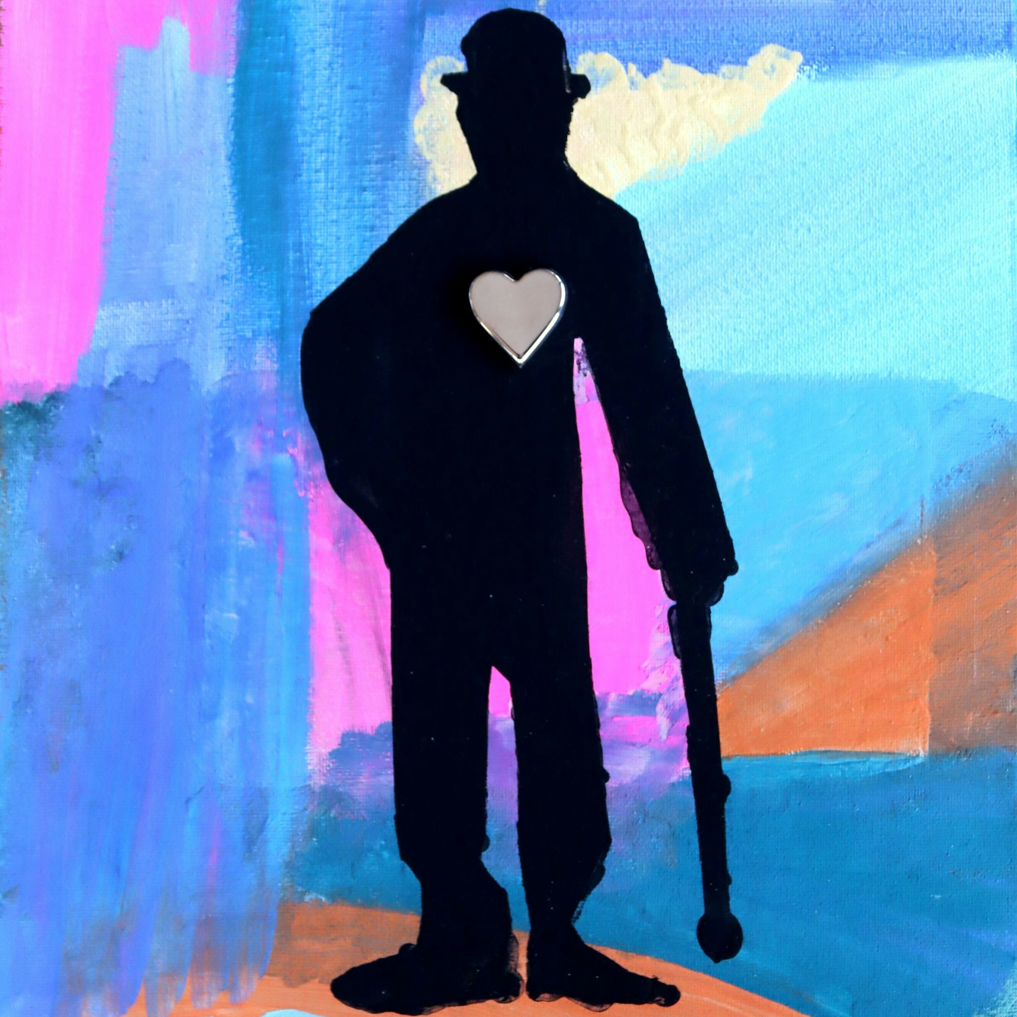 Die Silhouette von Charles Chaplin als Tramp ist auf bunten Hintergrund gemalt.