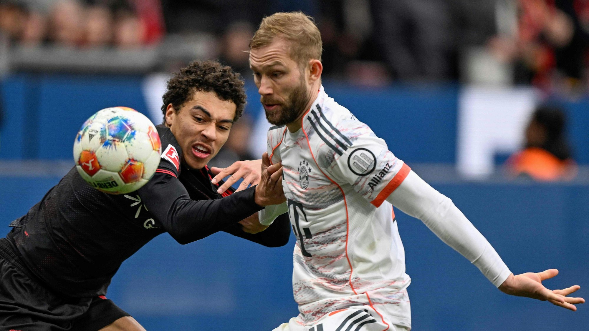 Bayern Munich's Austrian midfielder #27 Konrad Laimer (R) and Bayer Leverkusen's German forward #42 Montrell Culbreath vie for the ball during the German first division Bundesliga football match between Bayer 04 Leverkusen and FC Bayern Munich in Leverkusen, western Germany on March 14, 2026. (Photo by INA FASSBENDER / AFP) / DFL REGULATIONS PROHIBIT ANY USE OF PHOTOGRAPHS AS IMAGE SEQUENCES AND/OR QUASI-VIDEO