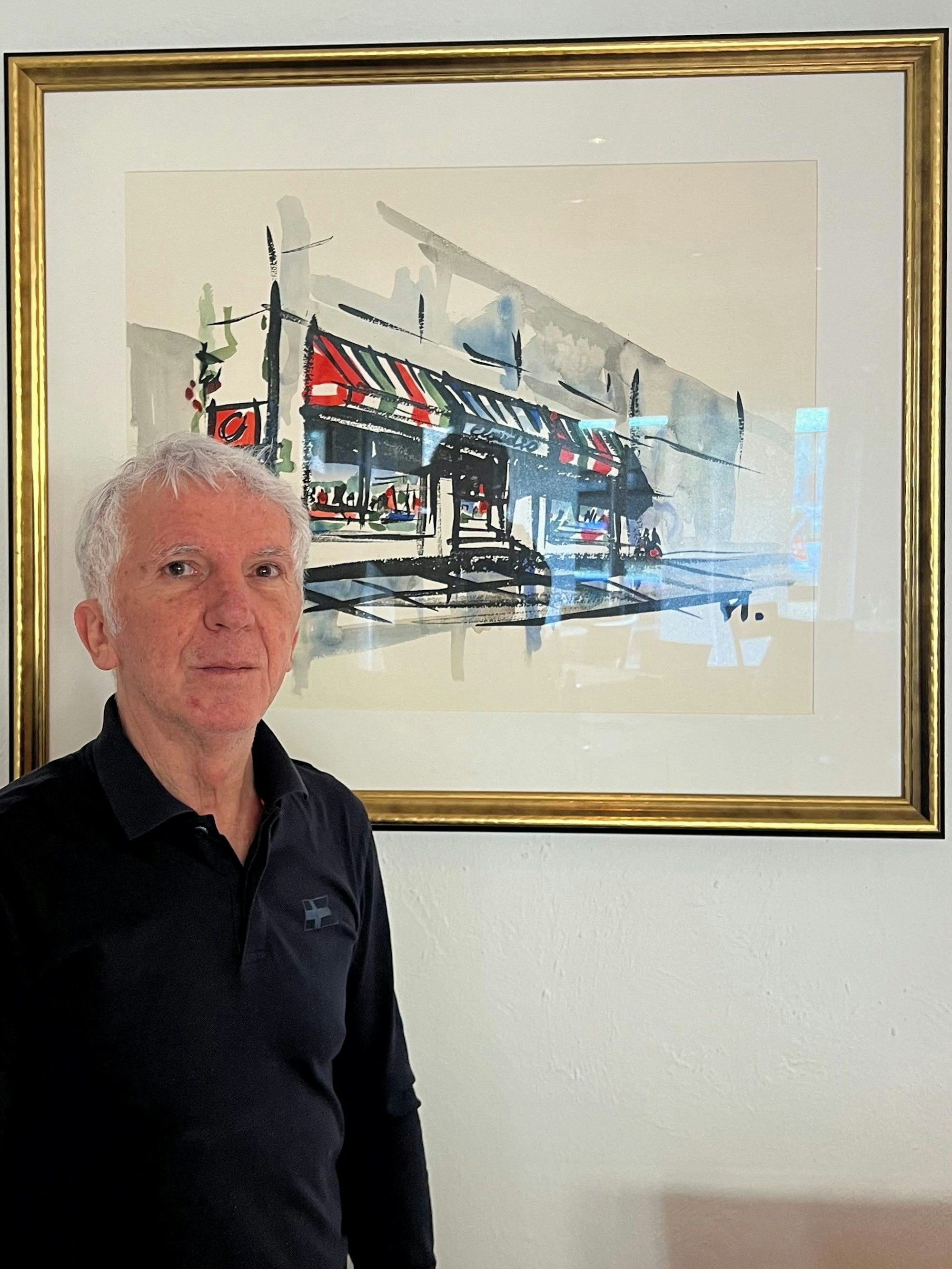 Gastronom Claudio Pezzuto vor einem Bild in seinem Lokal, das der Vater von Guido Westerwelles Ehemann gemalt hat.