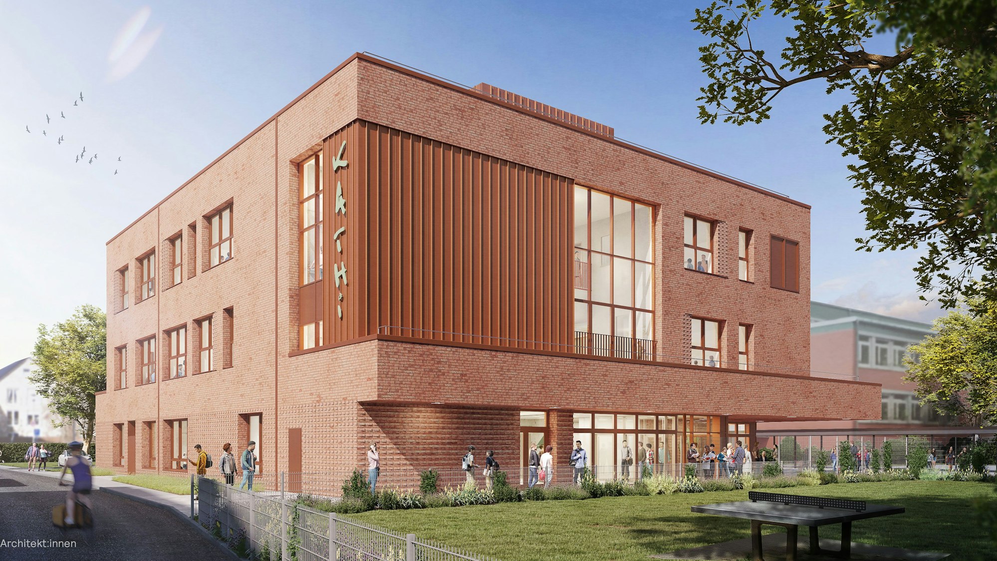 Ein Schulgebäude mit einer roten Klinkerfassade.