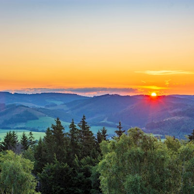 view from mountain Wilzenberg tower Wilzenbergturm in mountain range Rothaargebirge to Bödefeld telecommunications tower at sunrise Schmallenberg Sauerland Nordrhein-Westfalen, North Rhine Germany