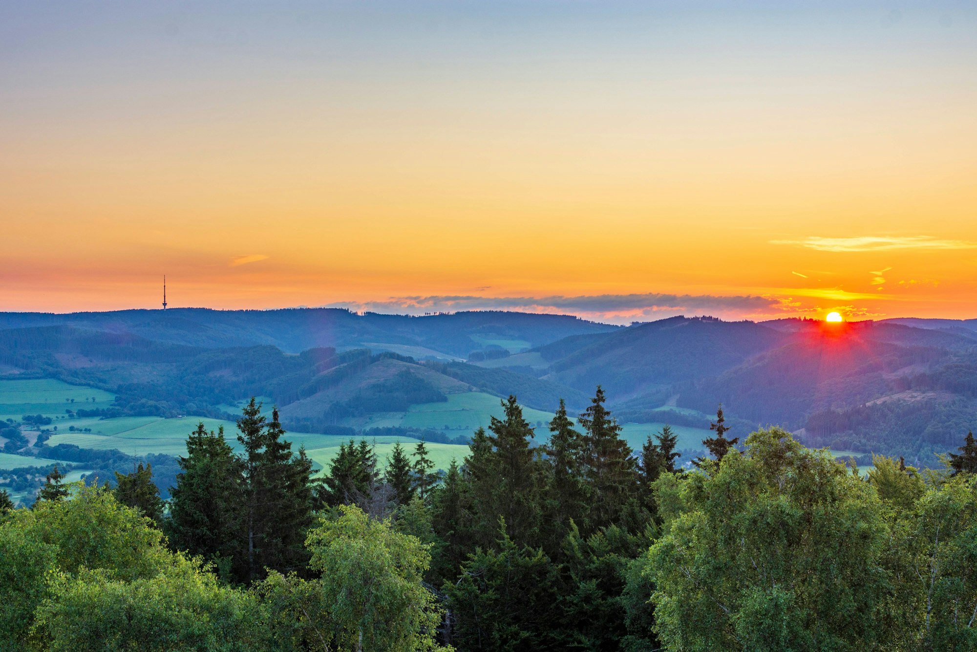 view from mountain Wilzenberg tower Wilzenbergturm in mountain range Rothaargebirge to Bödefeld telecommunications tower at sunrise Schmallenberg Sauerland Nordrhein-Westfalen, North Rhine Germany