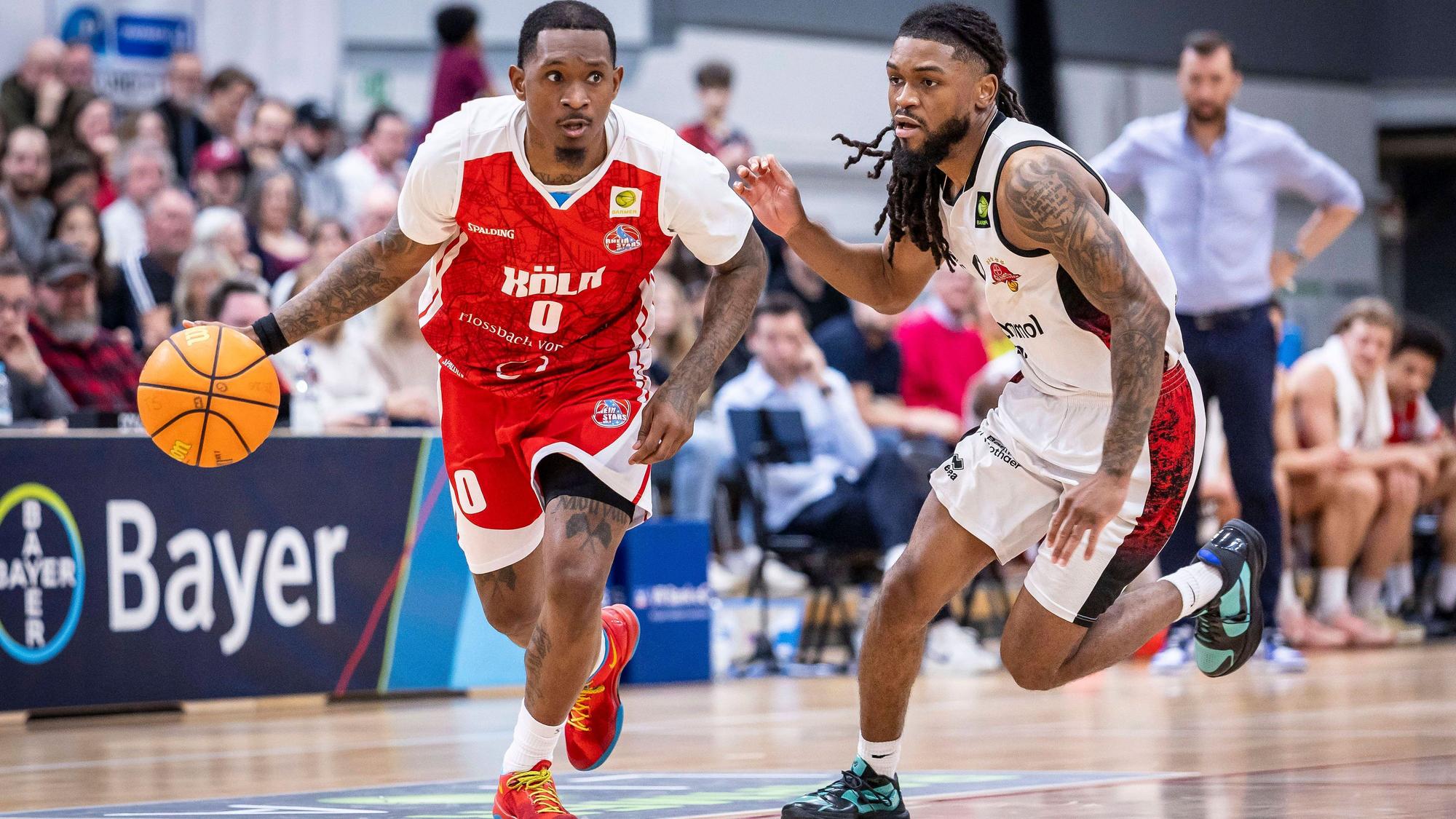 Barmer 2. Basketball Bundesliga ProA: Bayer Giants Leverkusen vs. RheinStars Koeln, 04.04.26 Leverkusen, 04.04.26 - Cedric Cezell Russell Jr. RheinStars Köln, 0 und Kobe Langley Bayer Giants Leverkusen, 8 während des Spiels der Barmer 2. Basketball Bundesliga ProA: Bayer Giants Leverkusen vs. RheinStars Koeln in der Ostermann Arena in Leverkusen. *** Barmer 2 Basketball Bundesliga ProA Bayer Giants Leverkusen vs RheinStars Koeln, 04 04 26 Leverkusen, 04 04 26 Cedric Cezell Russell Jr RheinStars Cologne, 0 and Kobe Langley Bayer Giants Leverkusen, 8 during the game of the Barmer 2 Basketball Bundesliga ProA Bayer Giants Leverkusen vs RheinStars Koeln at the Ostermann Arena in Leverkusen Copyright: xBEAUTIFULxSPORTS/LeahxKohringx