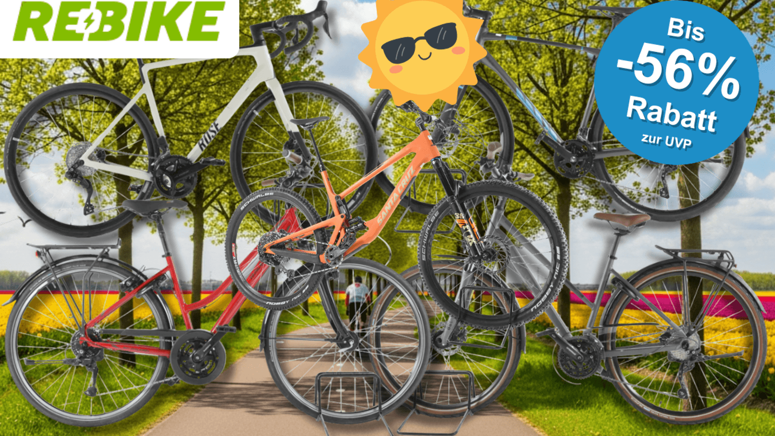 4 verschiedene Fahrräder vor einem Radweg im Frühling.