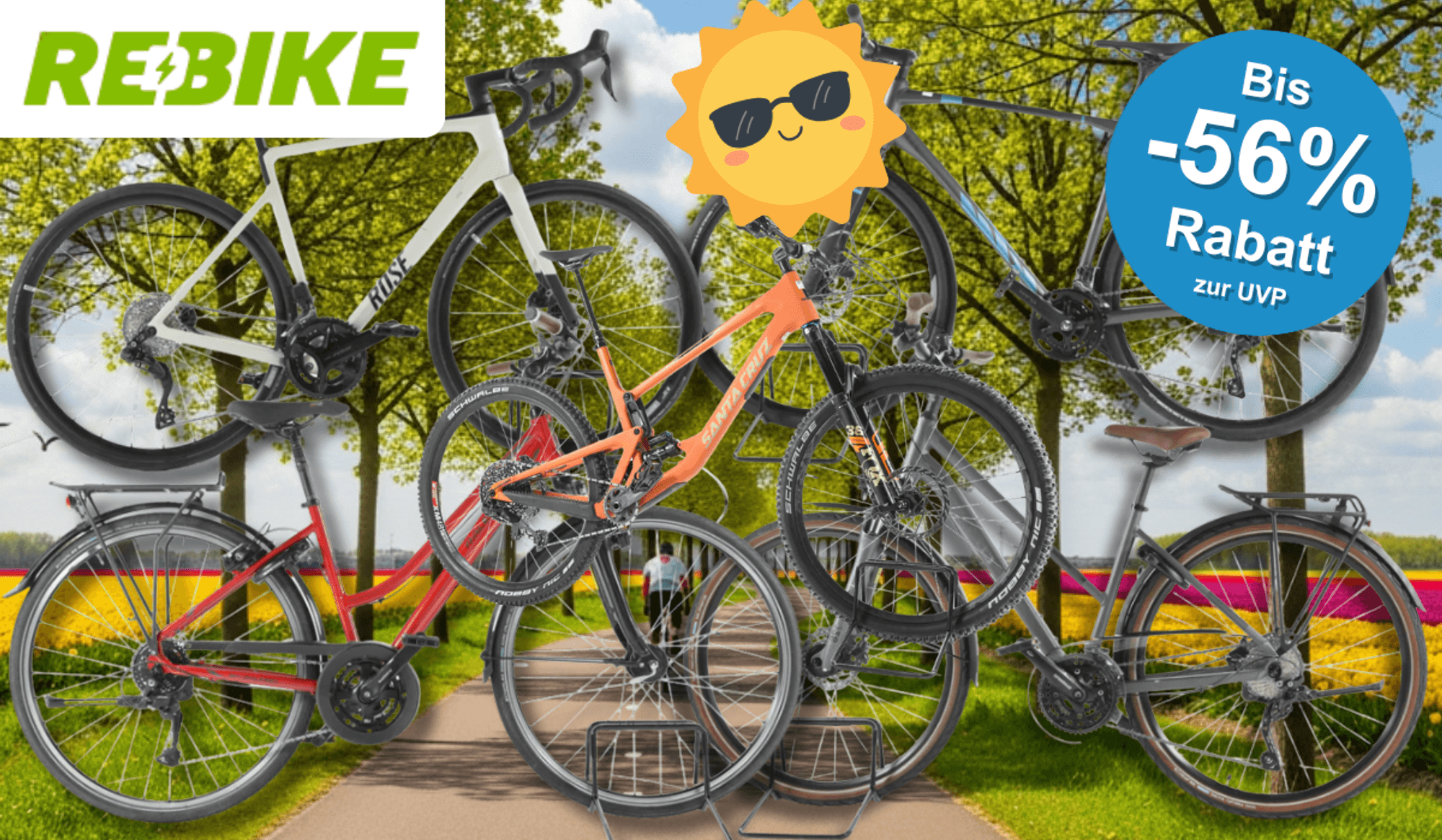 4 verschiedene Fahrräder vor einem Radweg im Frühling.